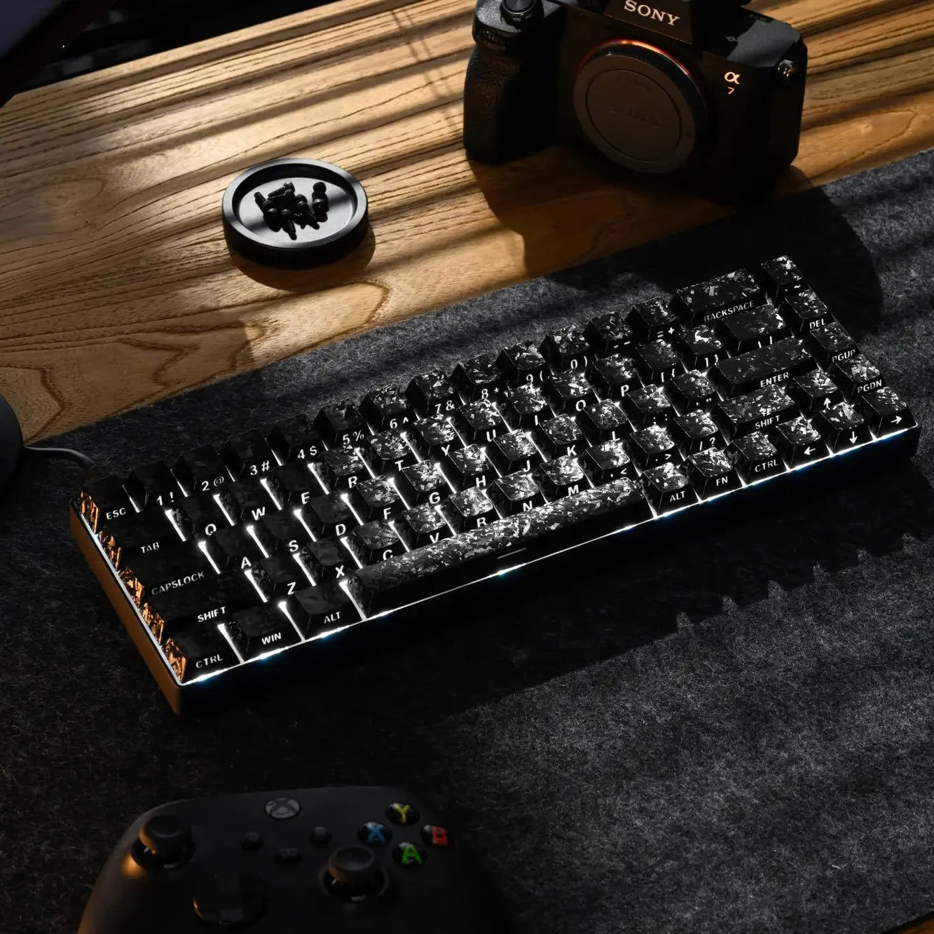 Black forged carbon-look PC keycaps set with side-printed shine-through legends on keyboard