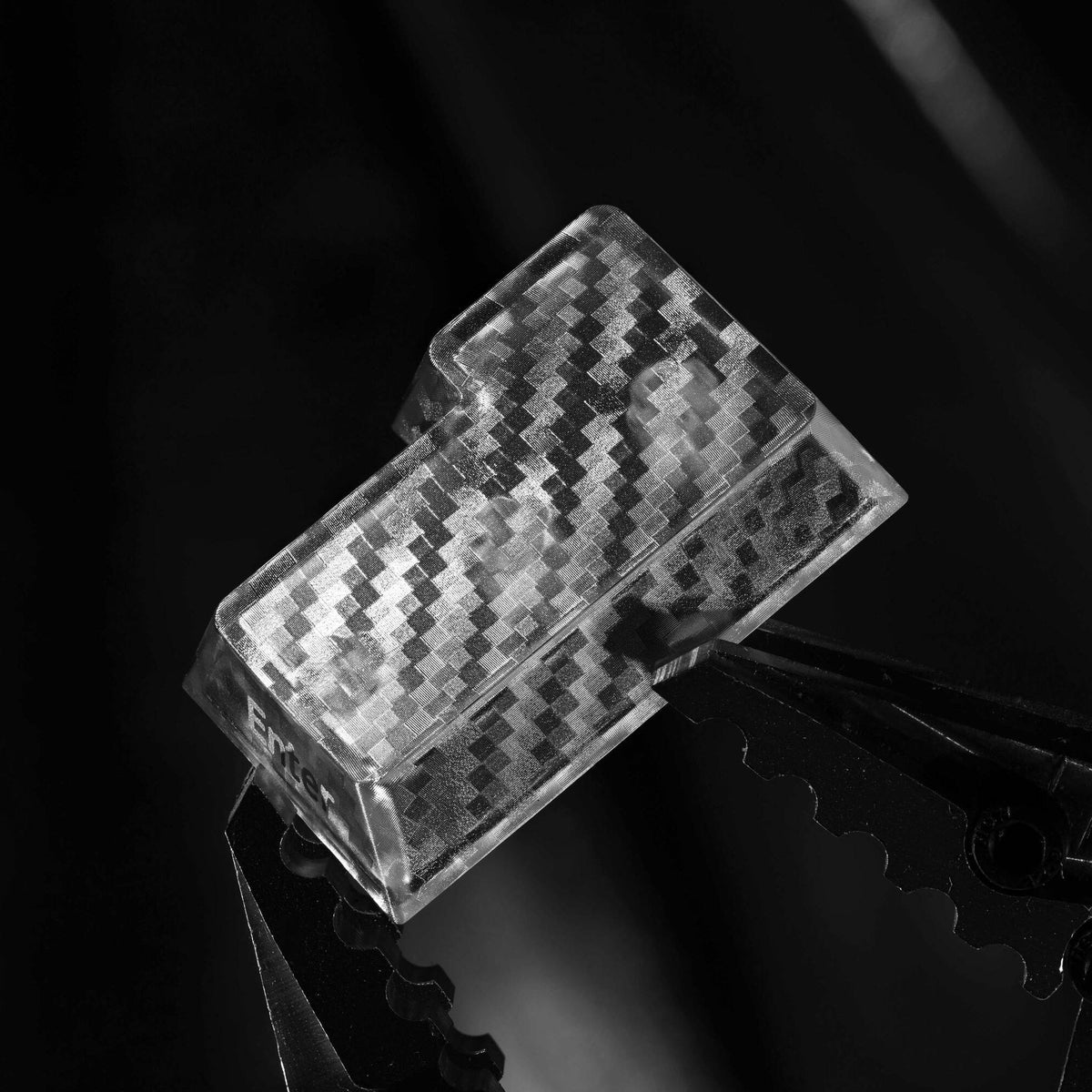 Clear cherry-profile keycap with carbon-fiber checkered texture