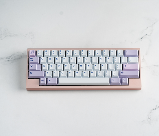 PBT keycap set on keyboard tray, white keys with blue and lilac symbols