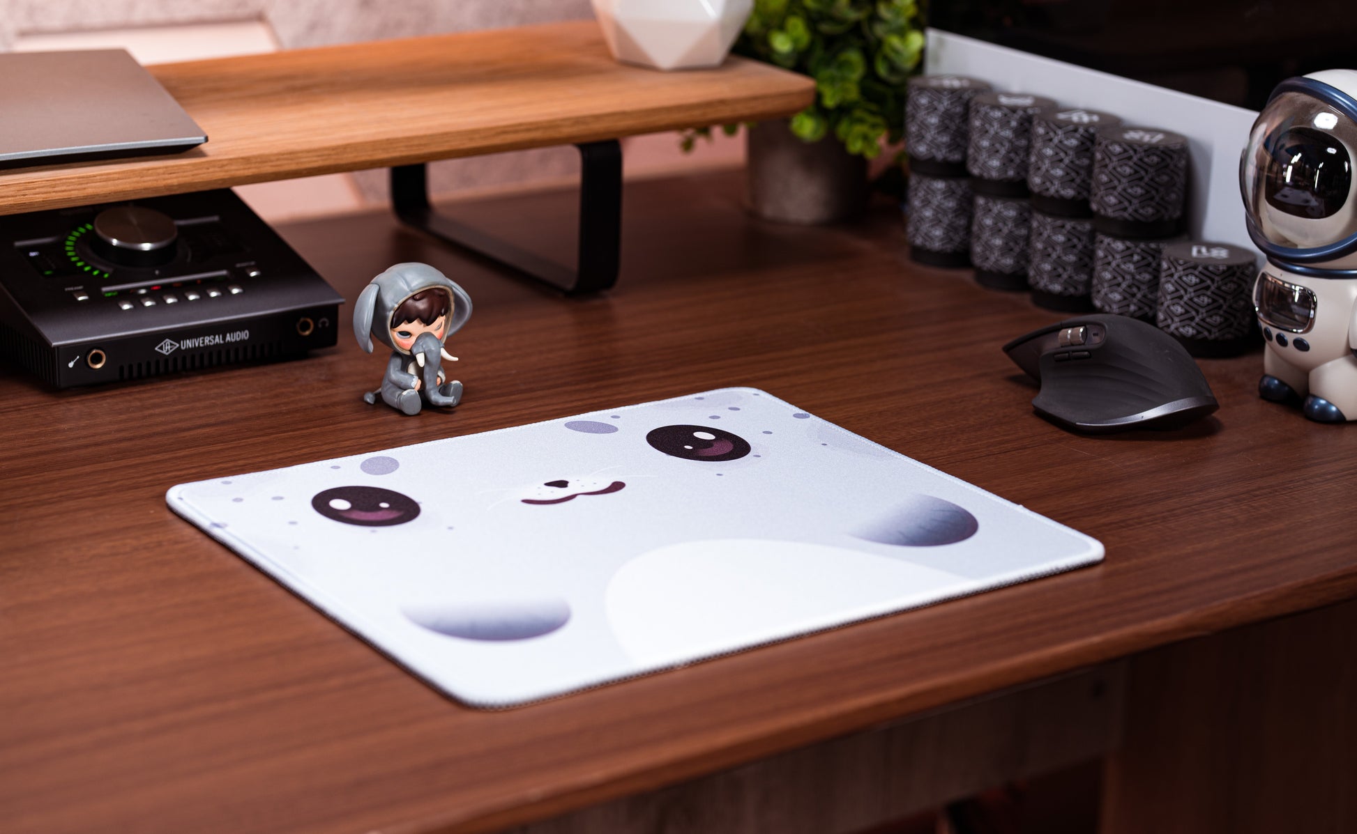 Seal-pattern desk mat on wooden desk, light blue with cute seal face and cheeks