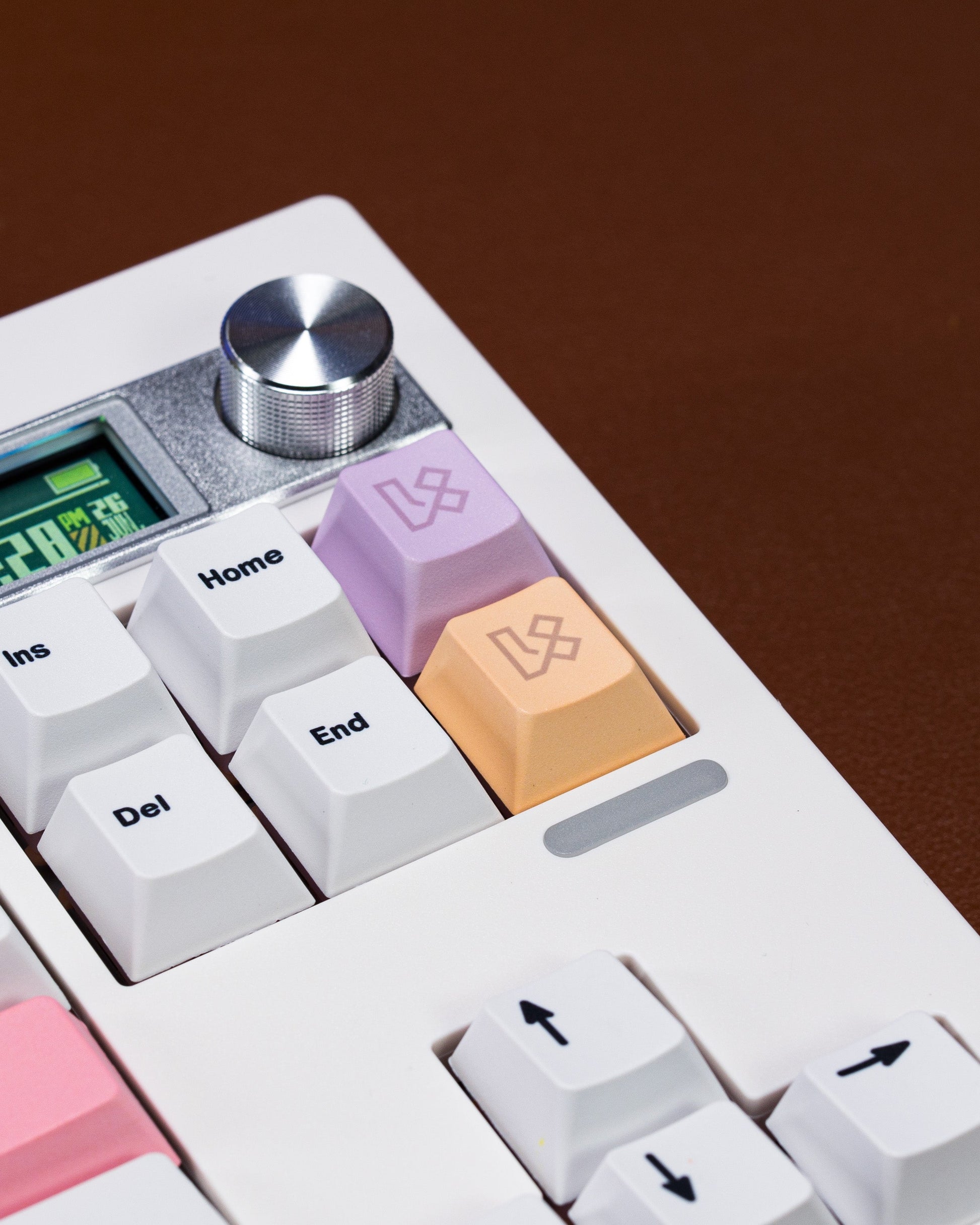 PBT keycaps closeup: pastel Home and End keycaps on a white keyboard base.