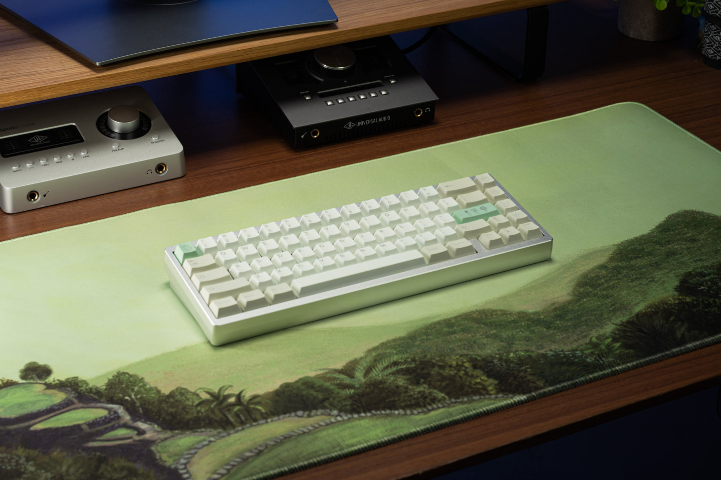 Keyboard keycaps in white with mint-green accents, centered on a light keyboard base