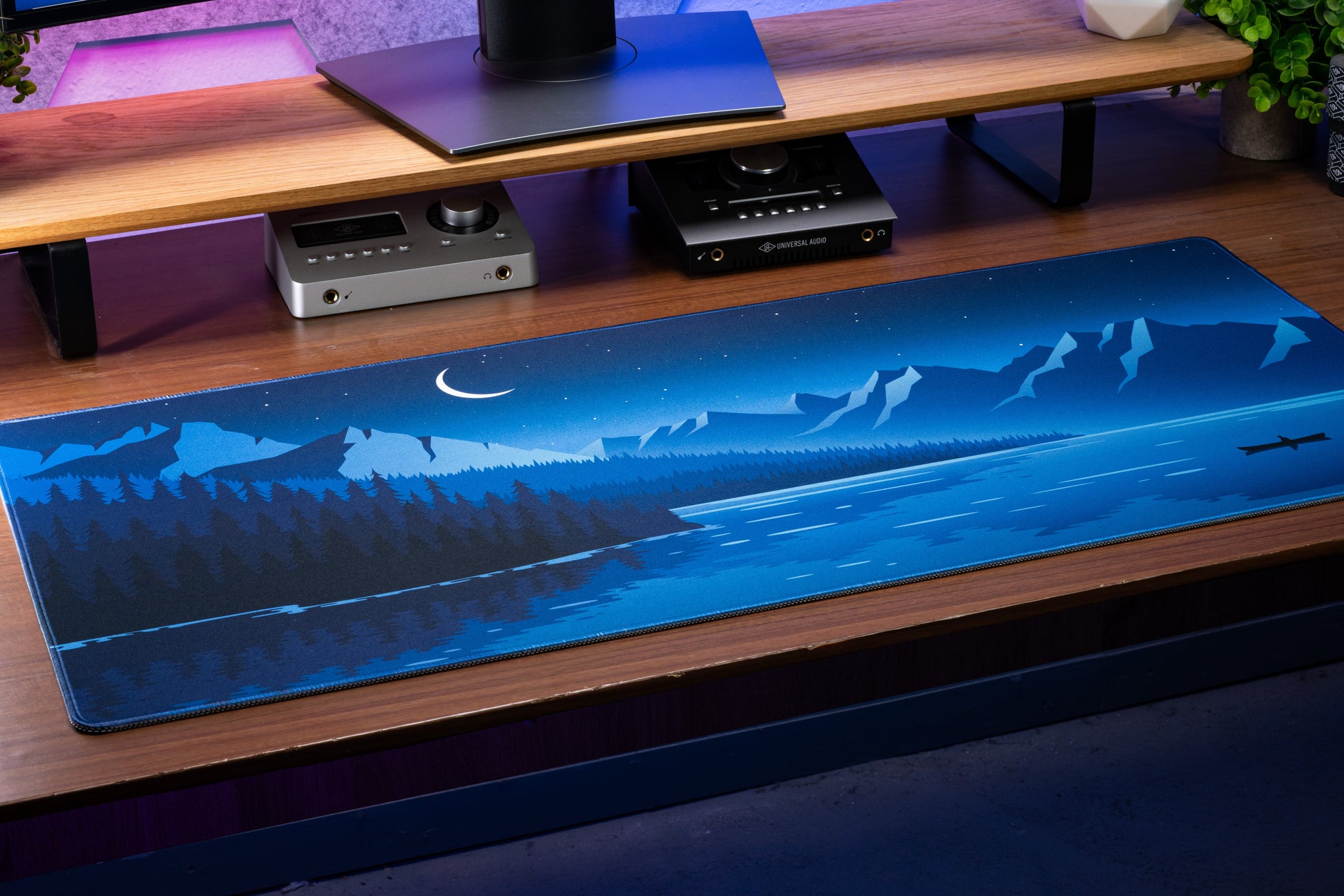 Blue desk mat with moon, mountain ridge and pine forest illustration, straight edges