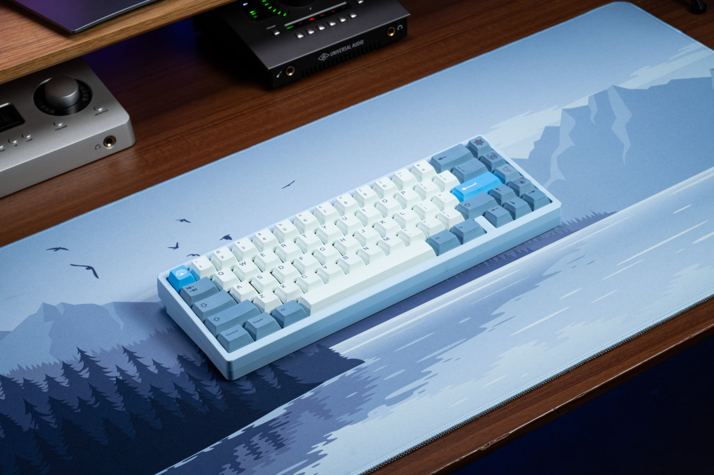 White and light-blue PBT keycaps with dark legends, centered on keyboard case