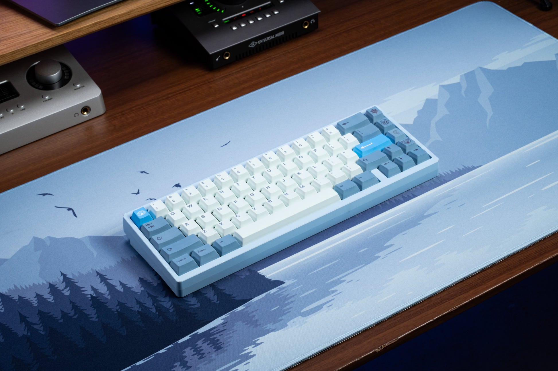 White and light-blue PBT keycaps with dark legends, centered on keyboard case