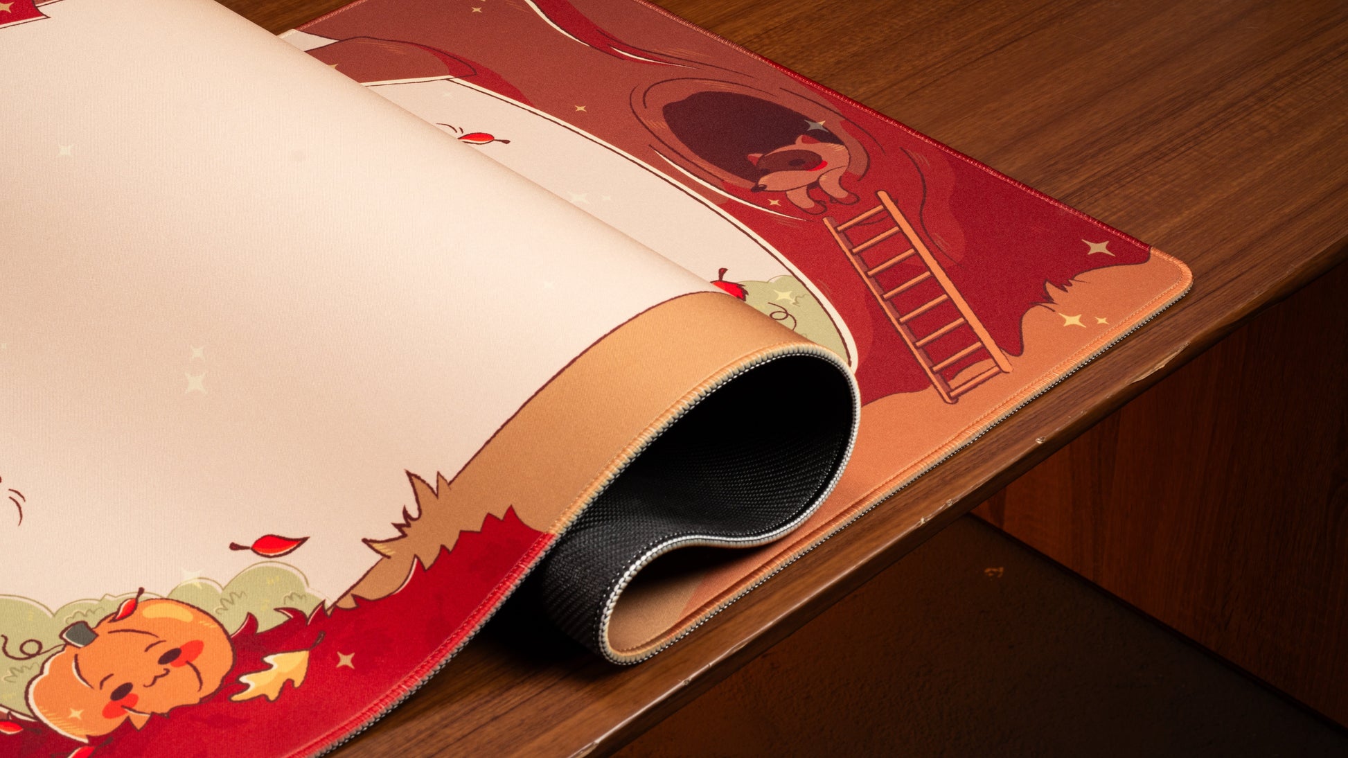 Pumpkin desk mat rolled edge, red border with pumpkin character, cream center and stars