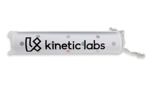 Desk mat roll with Kinetic labs logo and polka-dot pattern