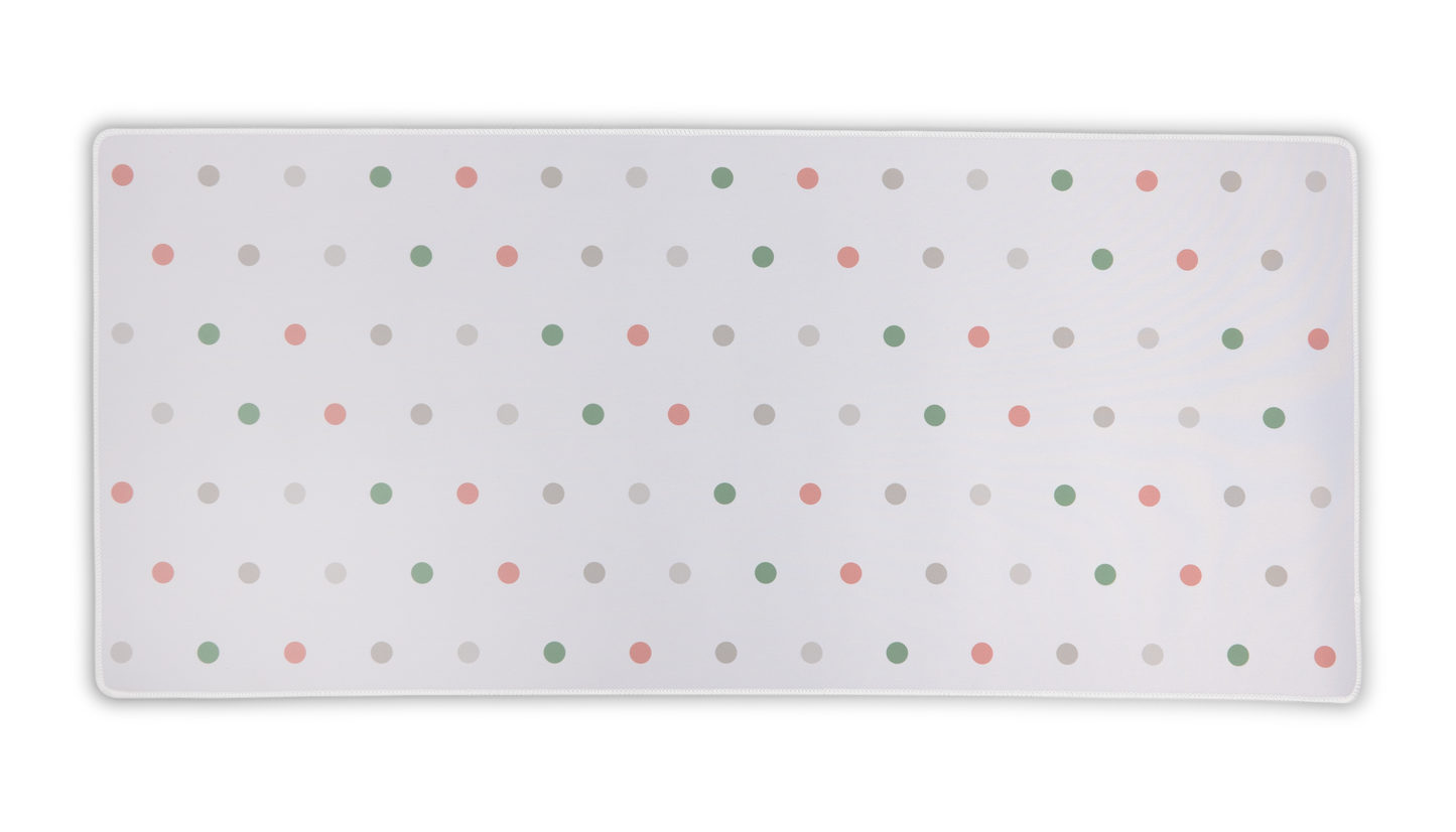 White desk mat with multicolor polka dots and rounded corners