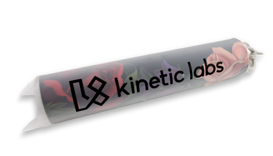 Rolled desk mat with Kinetic Labs logo and pink flower print