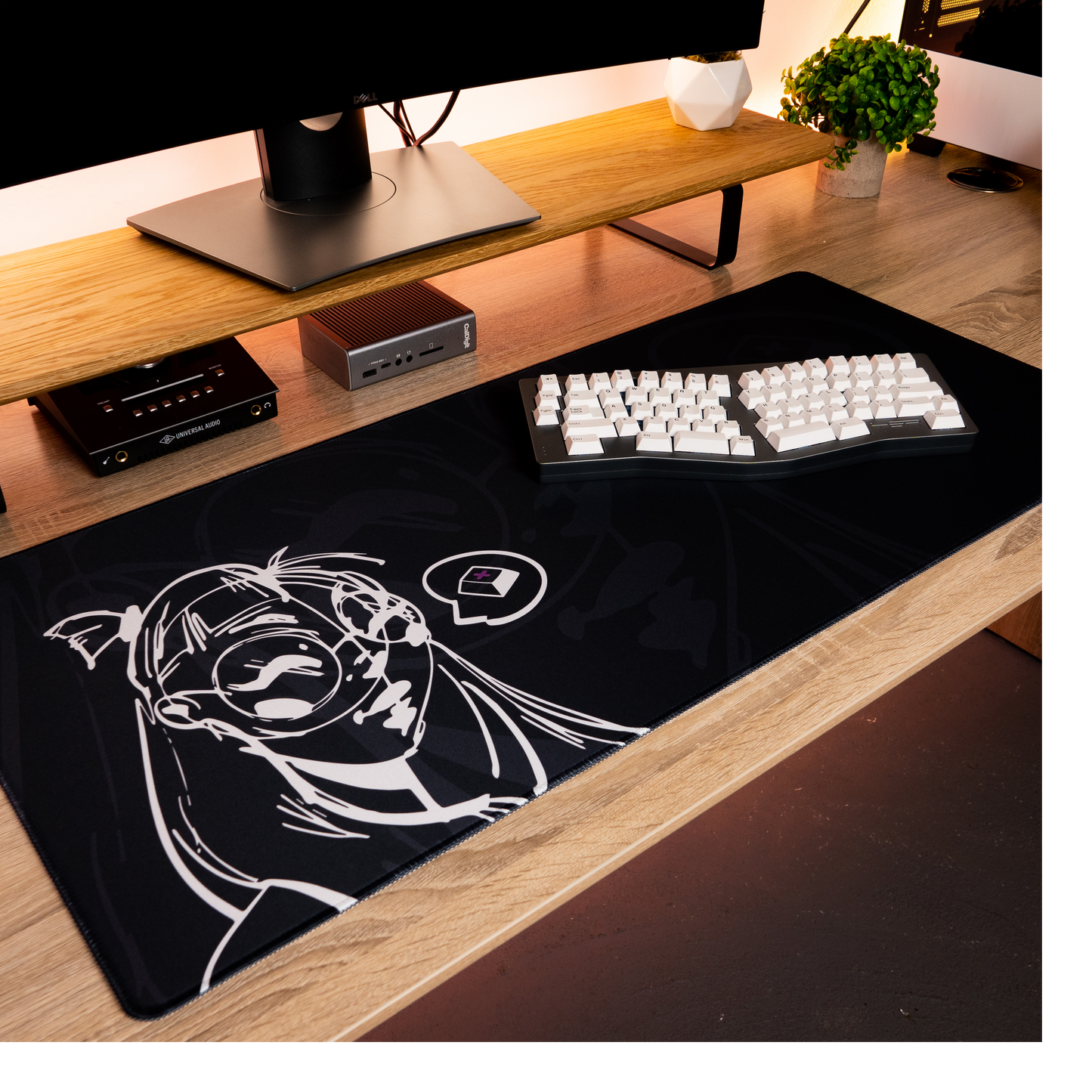 Black desk mat with white anime-style portrait and gaming icons graphic