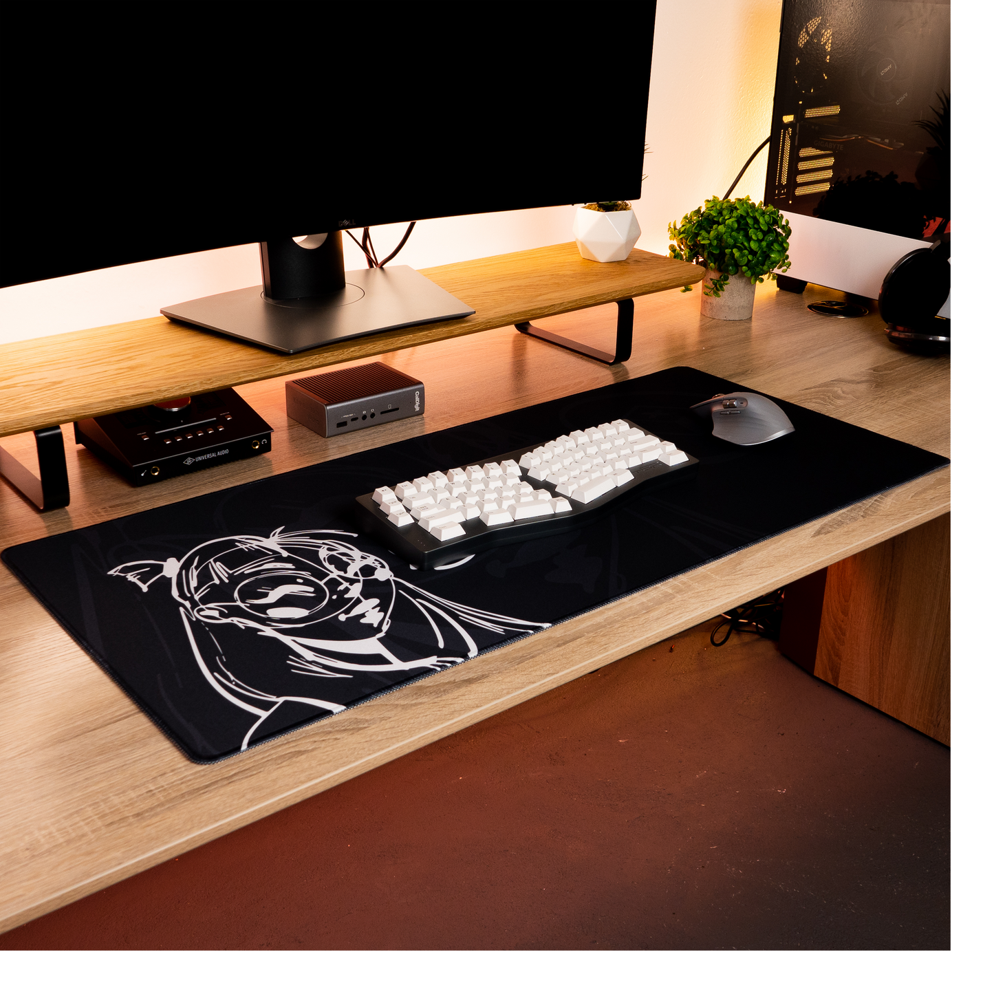 Black desk mat with white anime-style portrait graphic for keyboard and mouse use