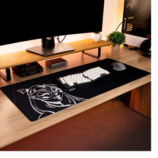 Black desk mat with white anime-style portrait graphic for keyboard and mouse use