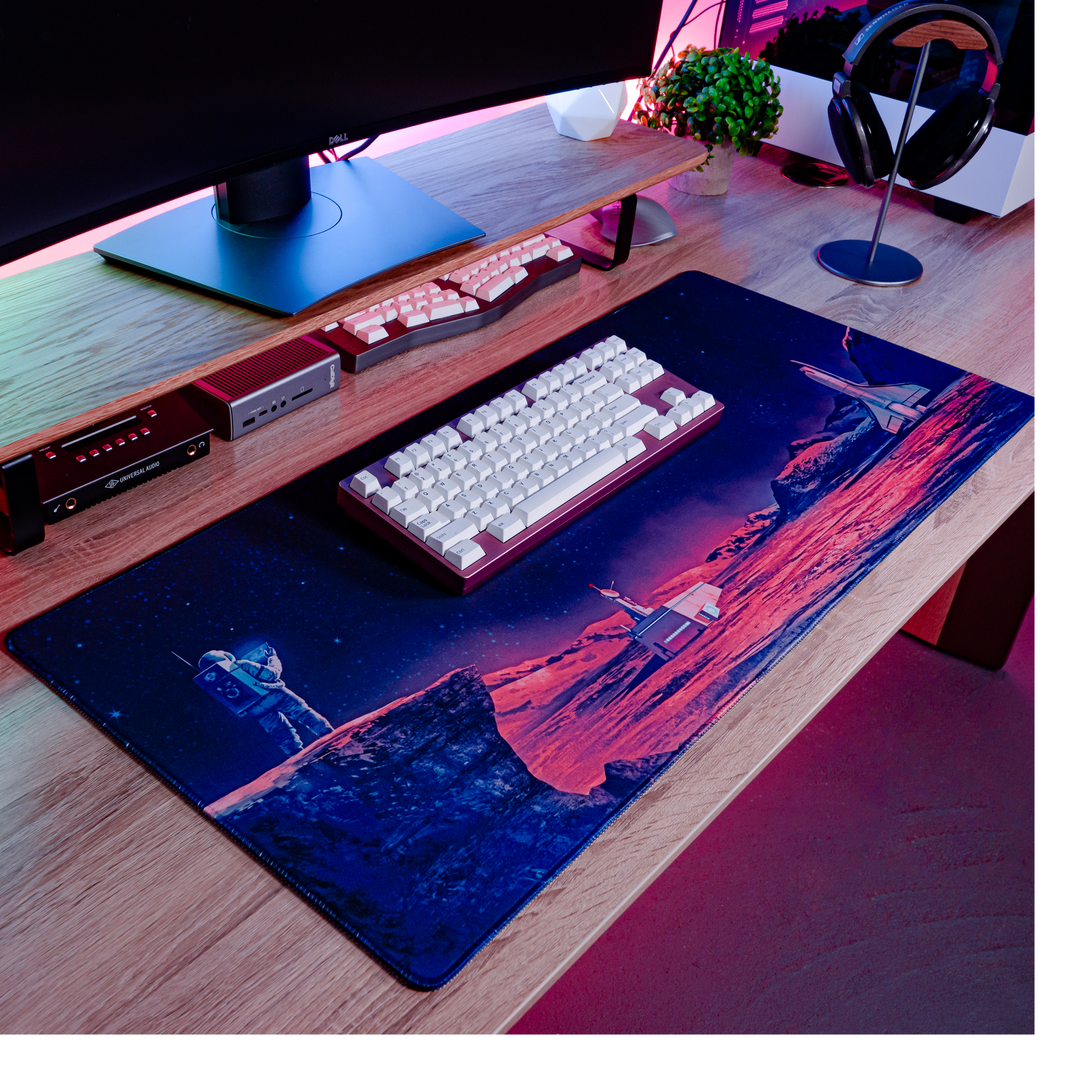 Rectangular desk mat with rounded edges, blue and purple space artwork