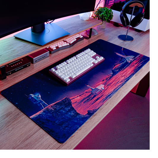 Rectangular desk mat with rounded edges, blue and purple space artwork
