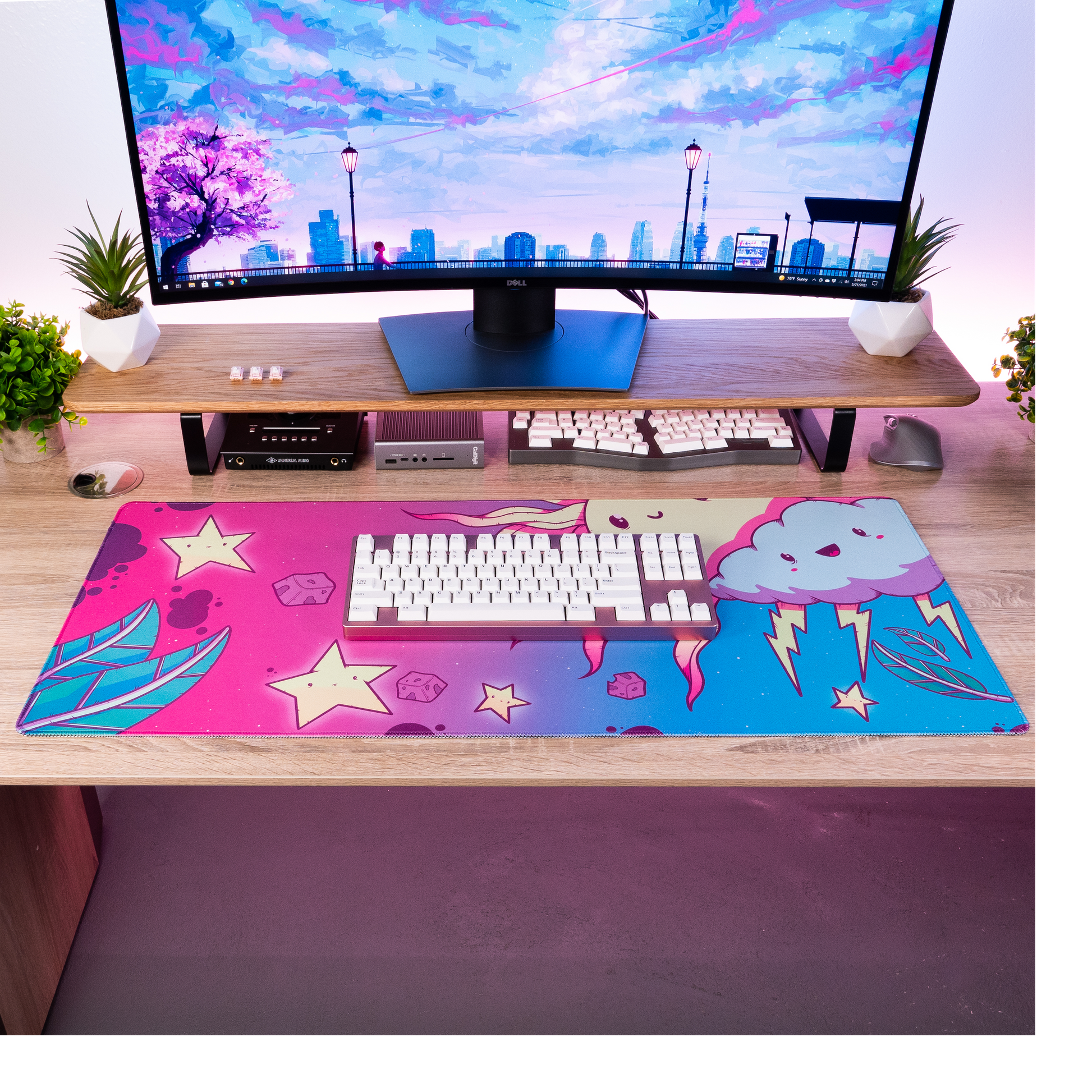 Purple and blue cartoon desk mat with cloud face, stars, and keyboard area