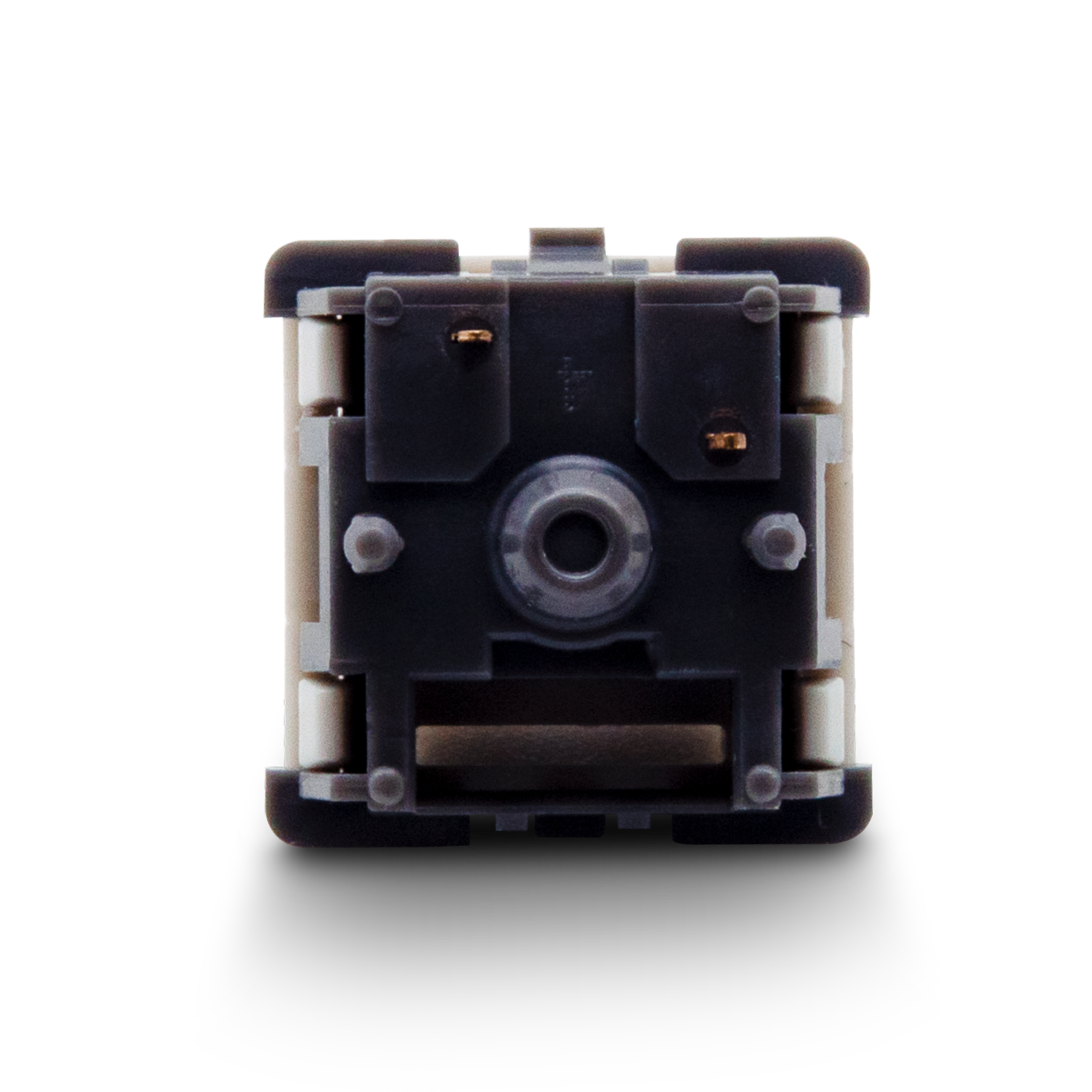 Mechanical switch rear view: white housing with black plate and circular opening