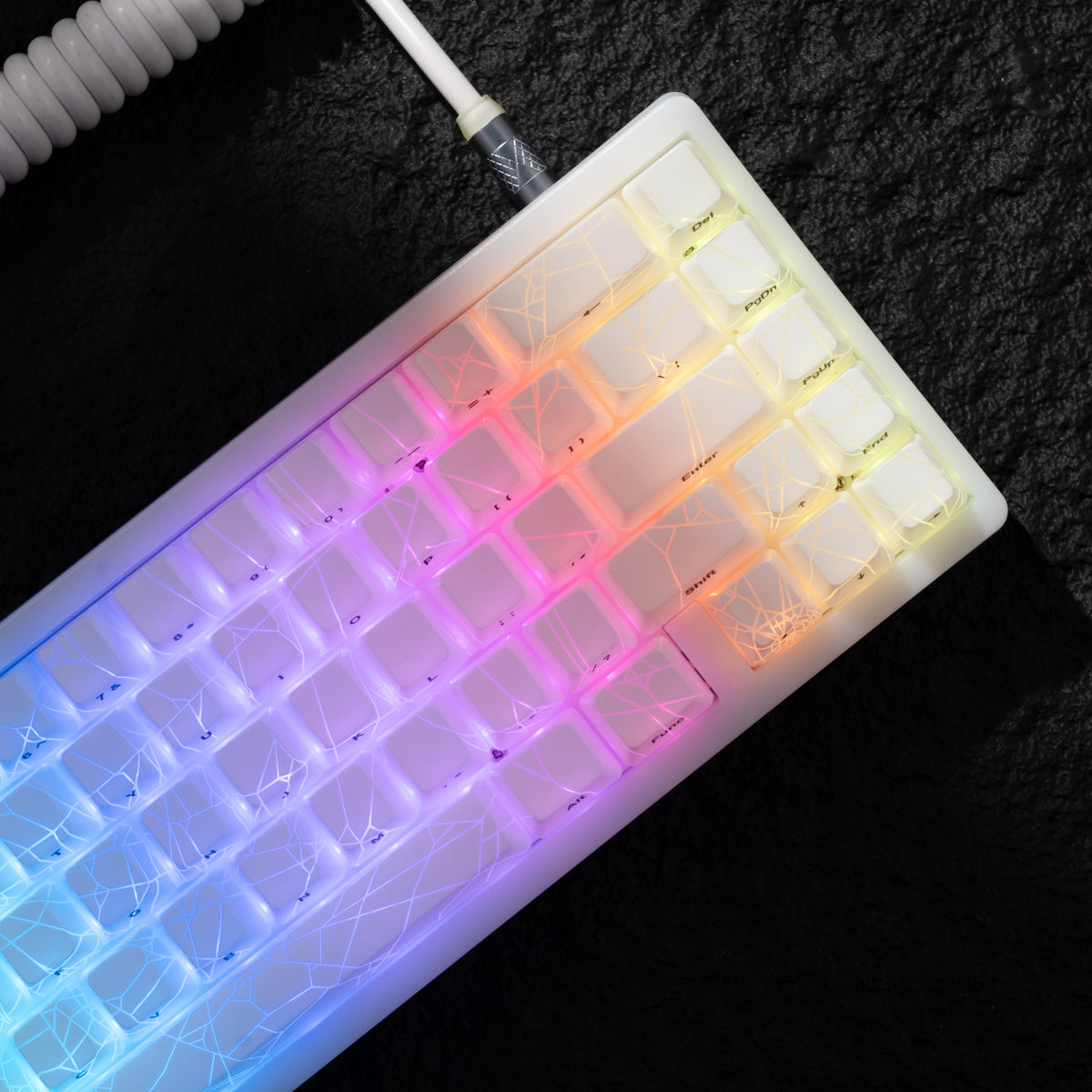 White mechanical keyboard angled view with rainbow RGB spider-web lighting