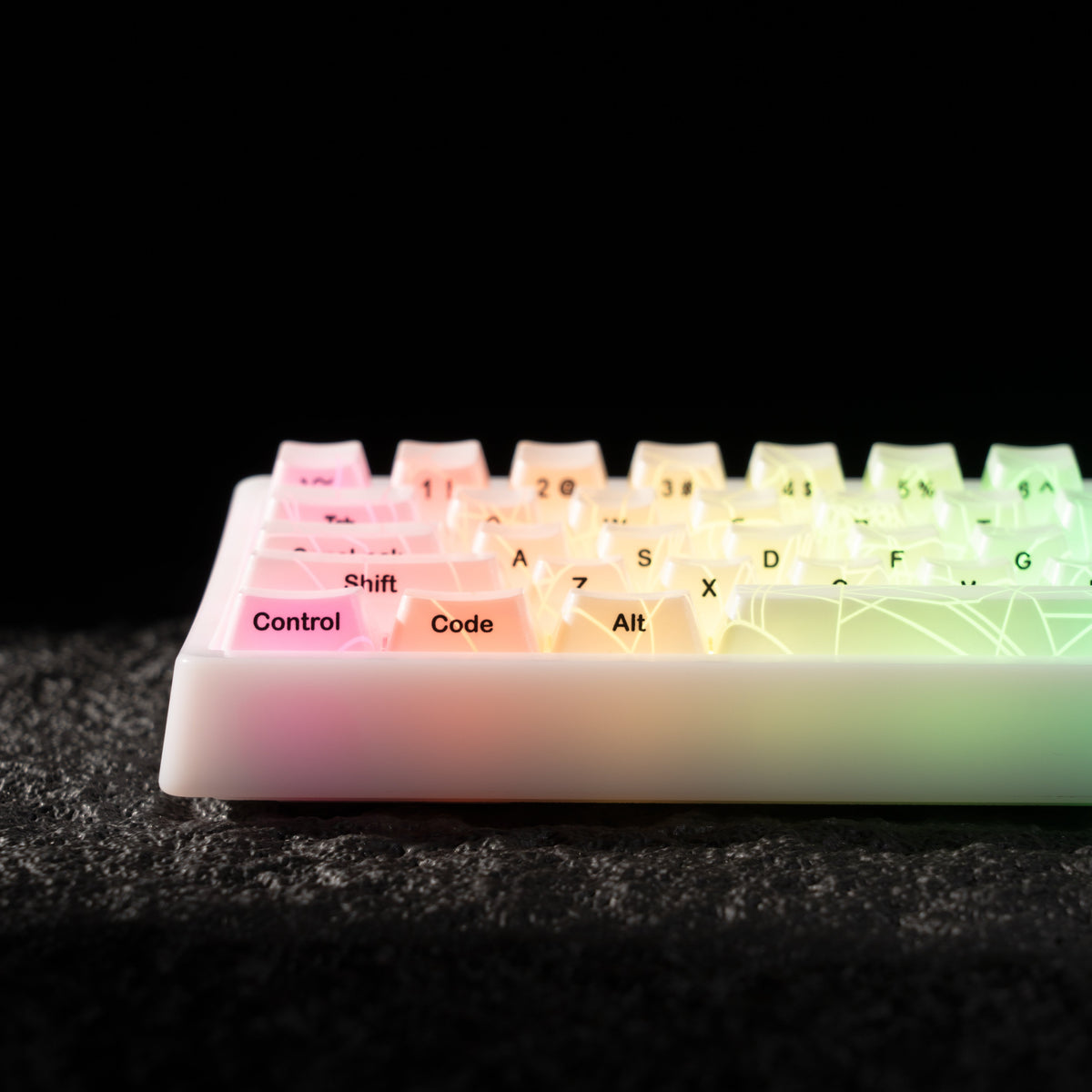 White mechanical keyboard side view with RGB-lit key legends