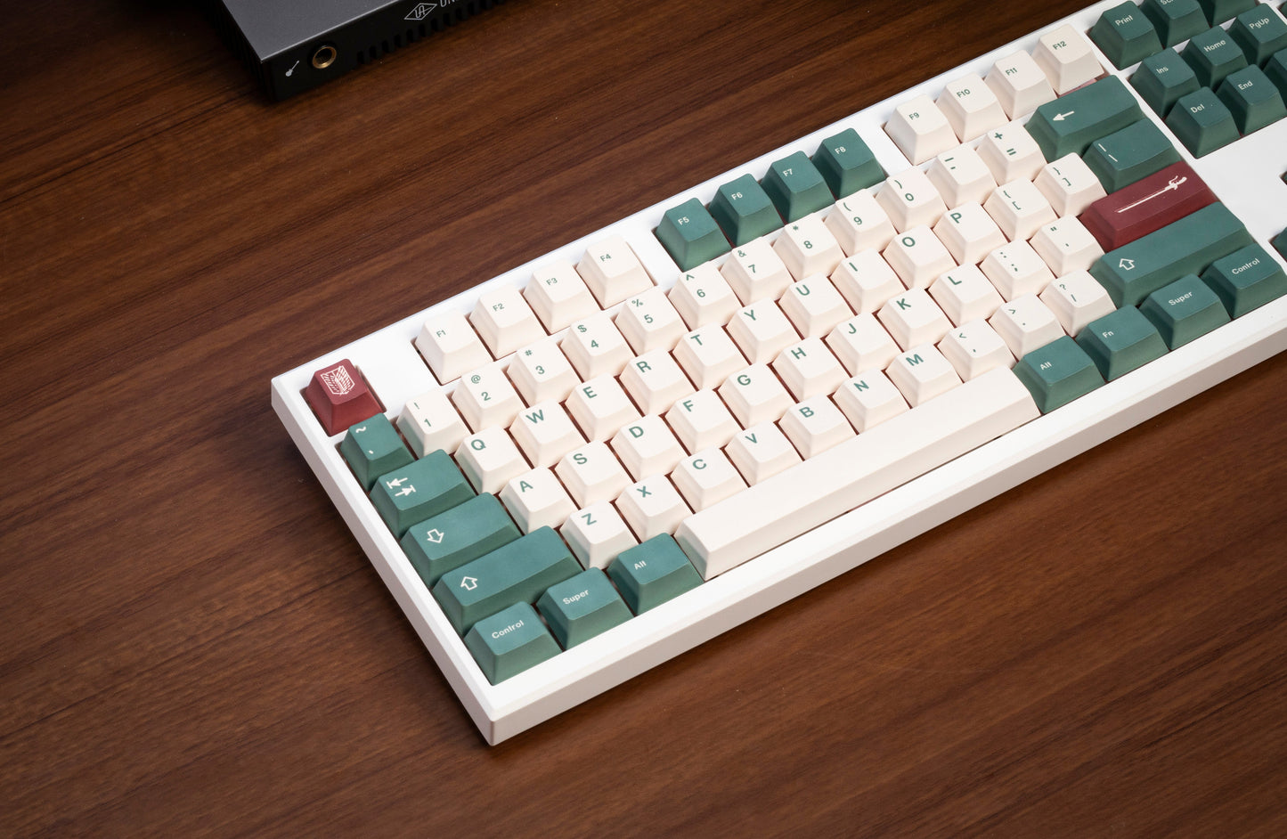 PBT keycaps on keyboard with white, dark green, and red keys and legends