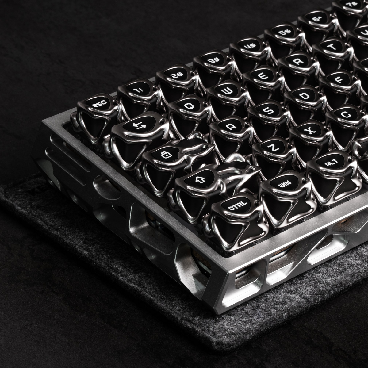 Silver metallic keycaps on a keyboard plate, glossy electroplated finish