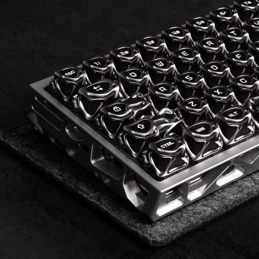 Silver metallic keycaps on a keyboard plate, glossy electroplated finish