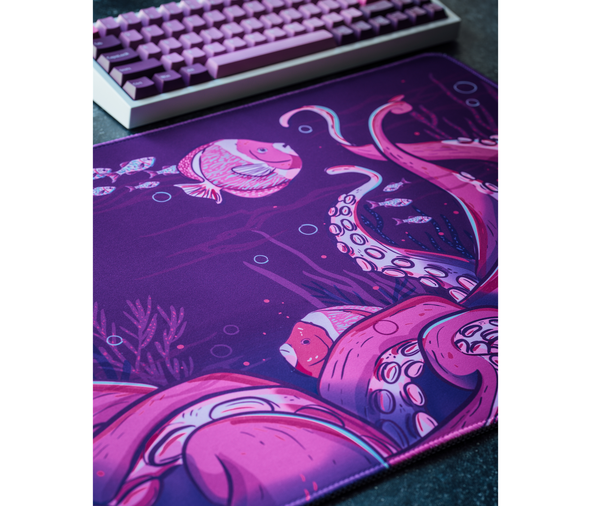 Octopus desk mat featuring deep purple octopus and fish illustrations