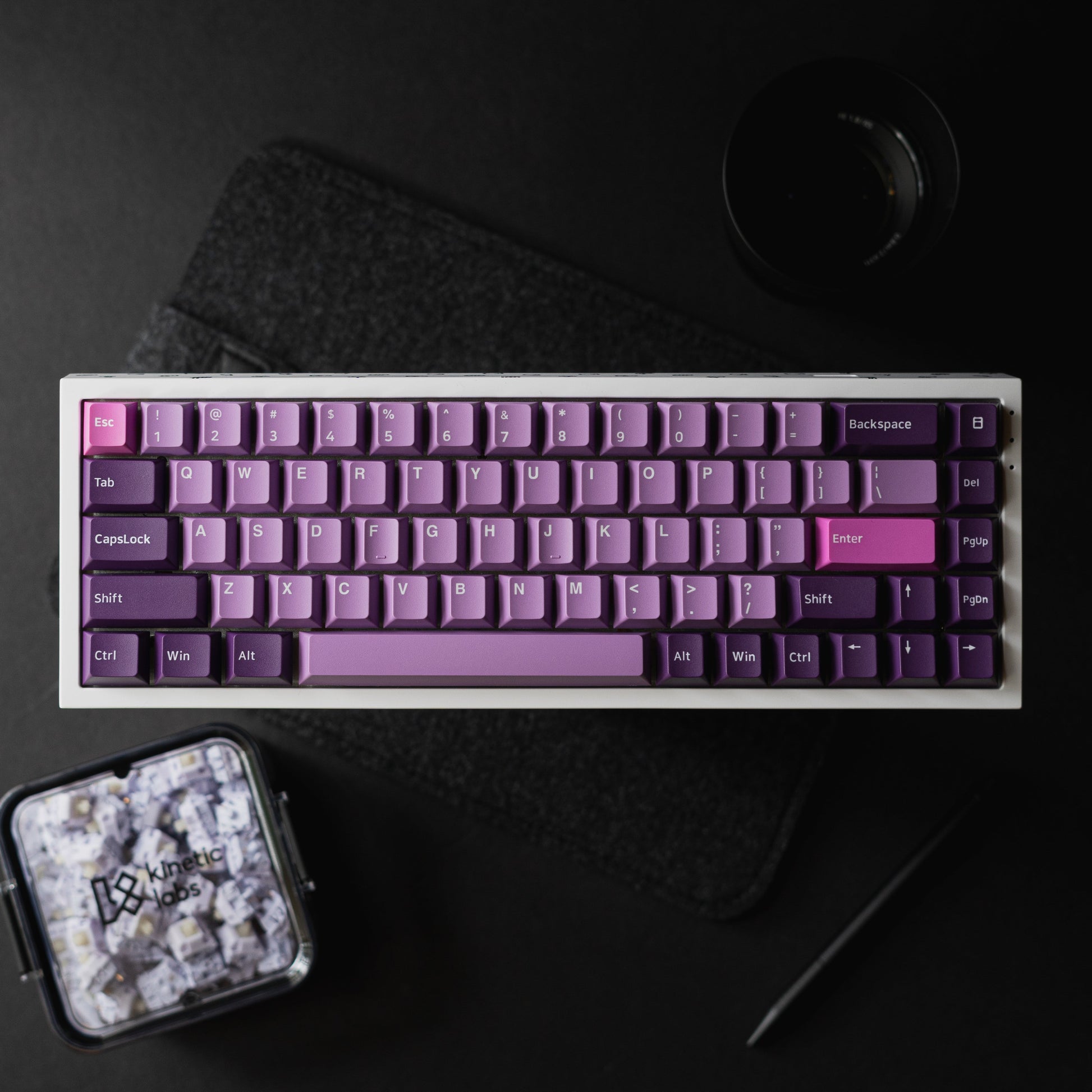 Purple PBT keycap set with octopus-themed legends on keyboard, angled view