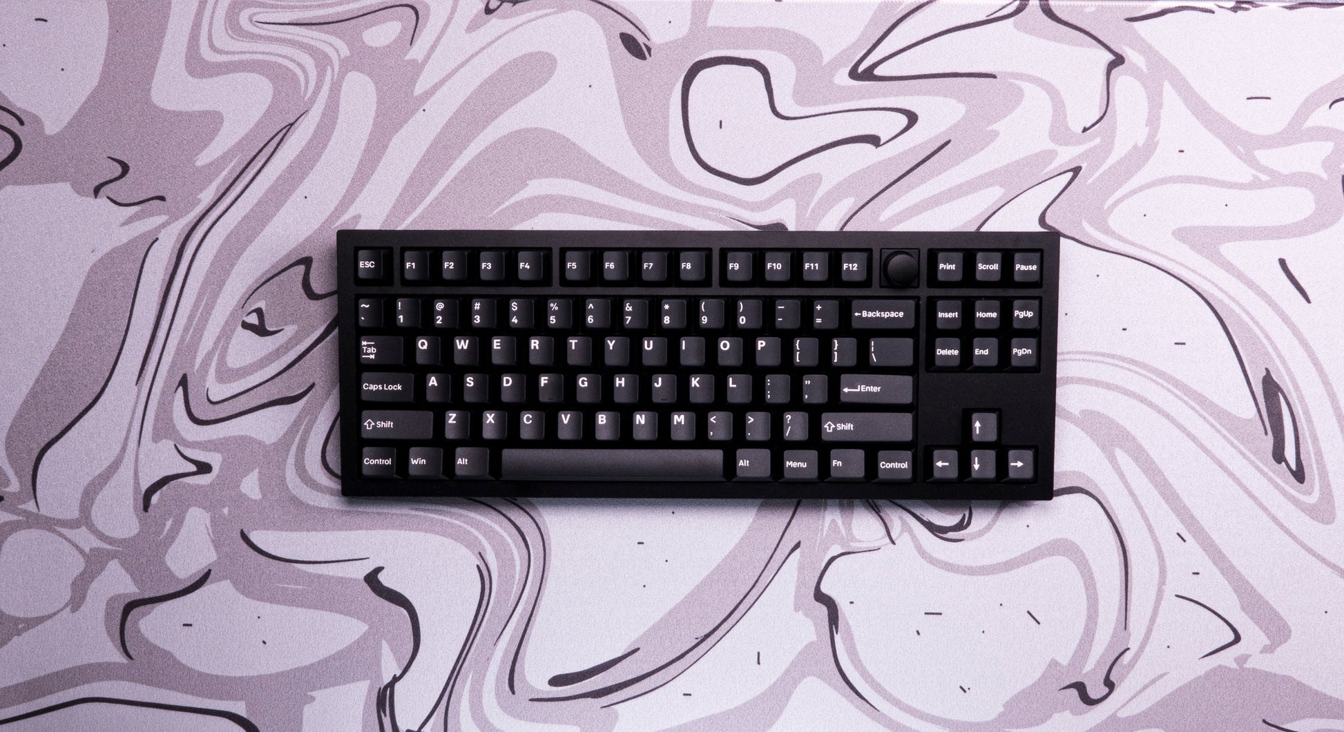 Desk mat with light purple and gray liquid marble swirl pattern, sized for keyboard