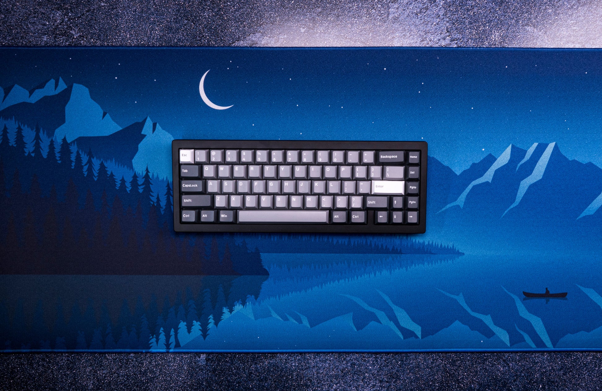Blue night desk mat with stars, moon, mountain silhouettes, and reflected water