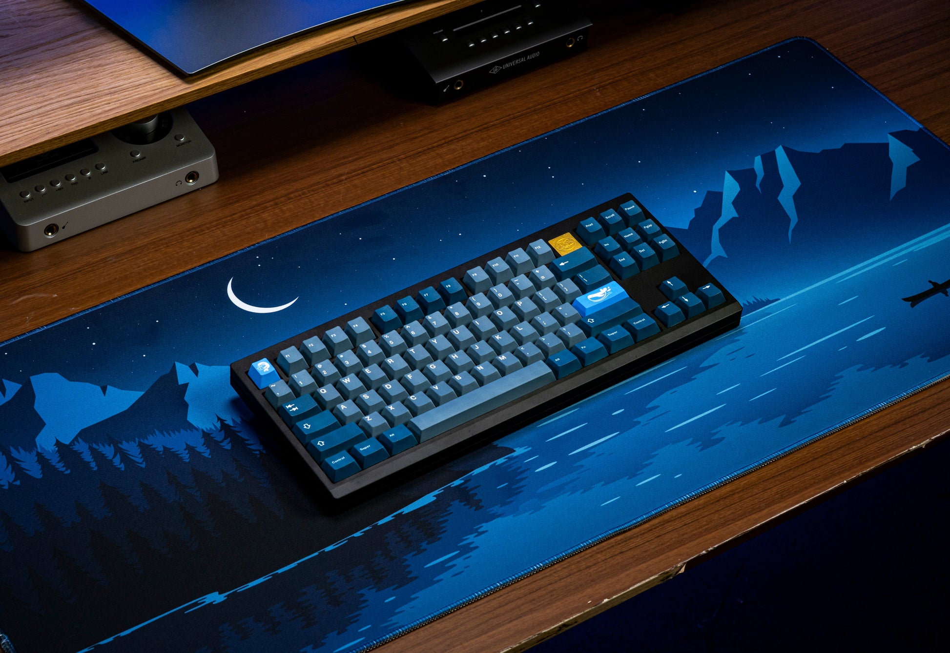 Blue keyboard keycaps with whale-themed icons, visible navigation and function keys