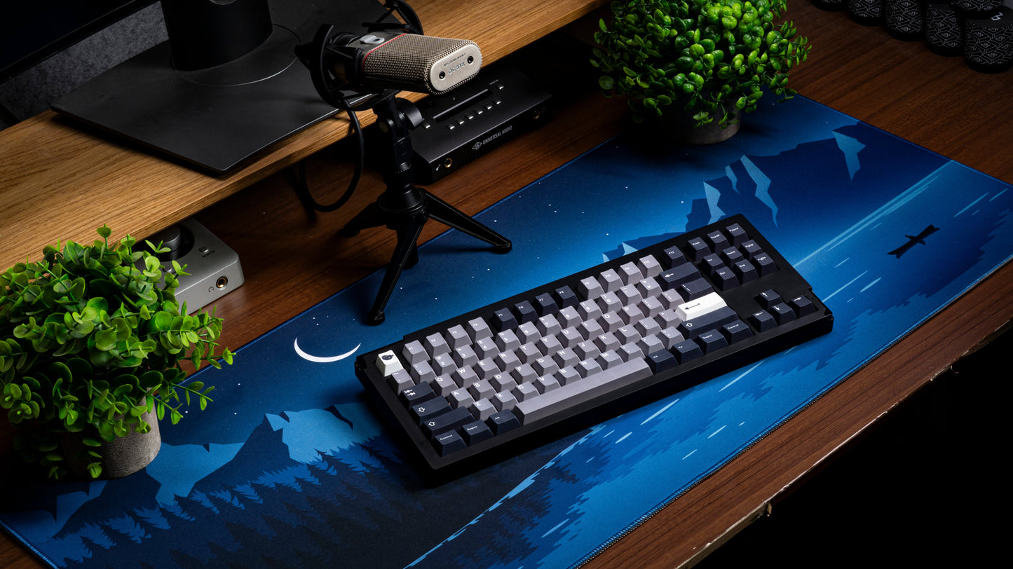 Keyboard with Seal-themed keycap set: dark keys and light gray legends