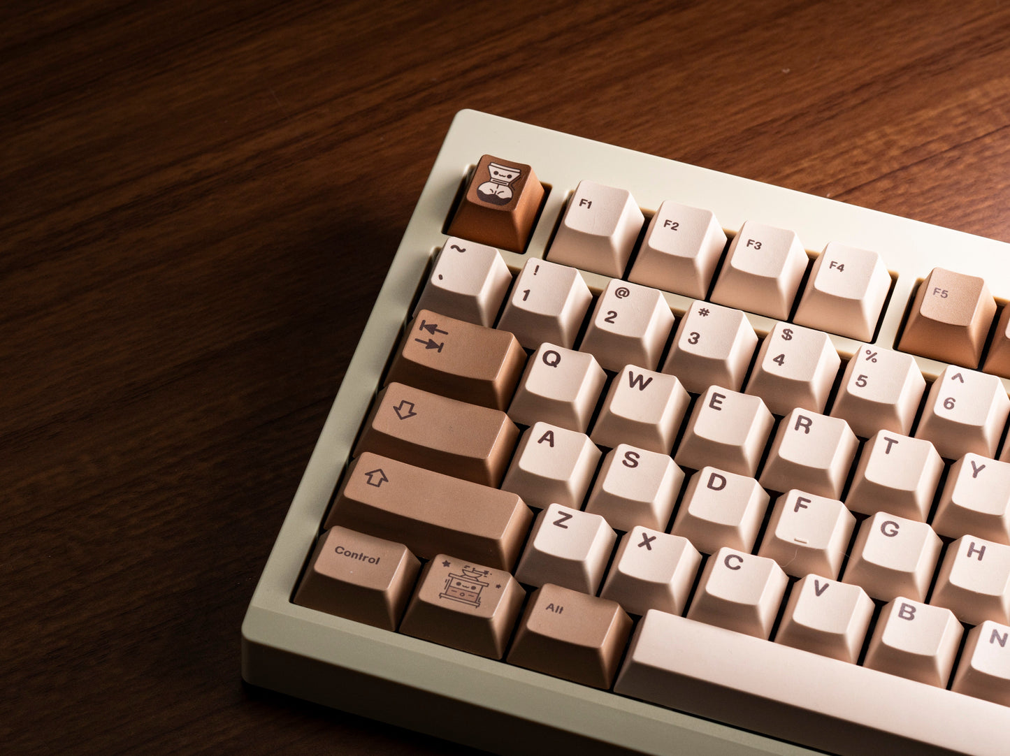 Coffee-themed PBT keycaps on keyboard, angled view with beige and brown key rows