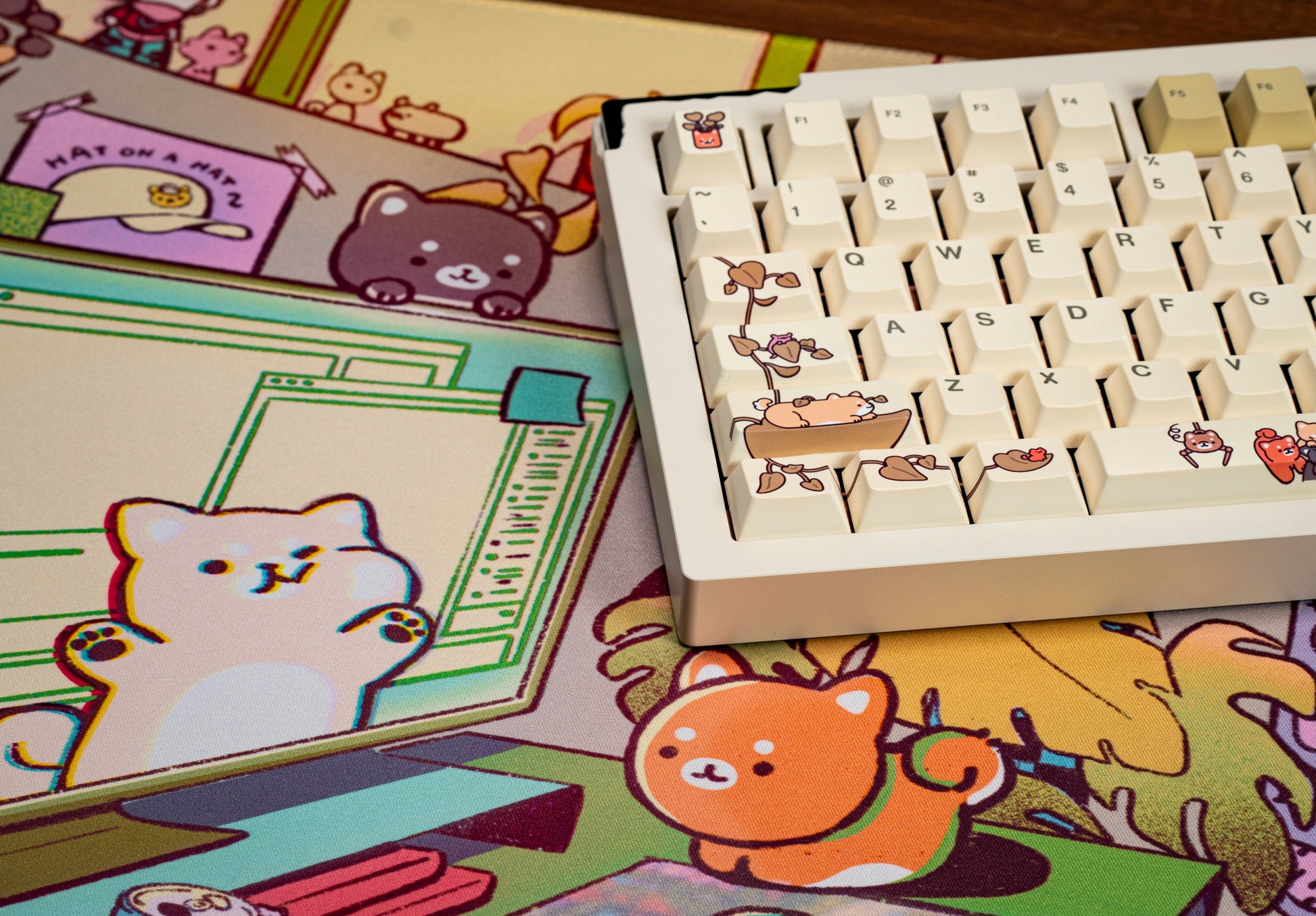 Close-up of cream keycaps showing cartoon animal prints and colorful illustrated legends