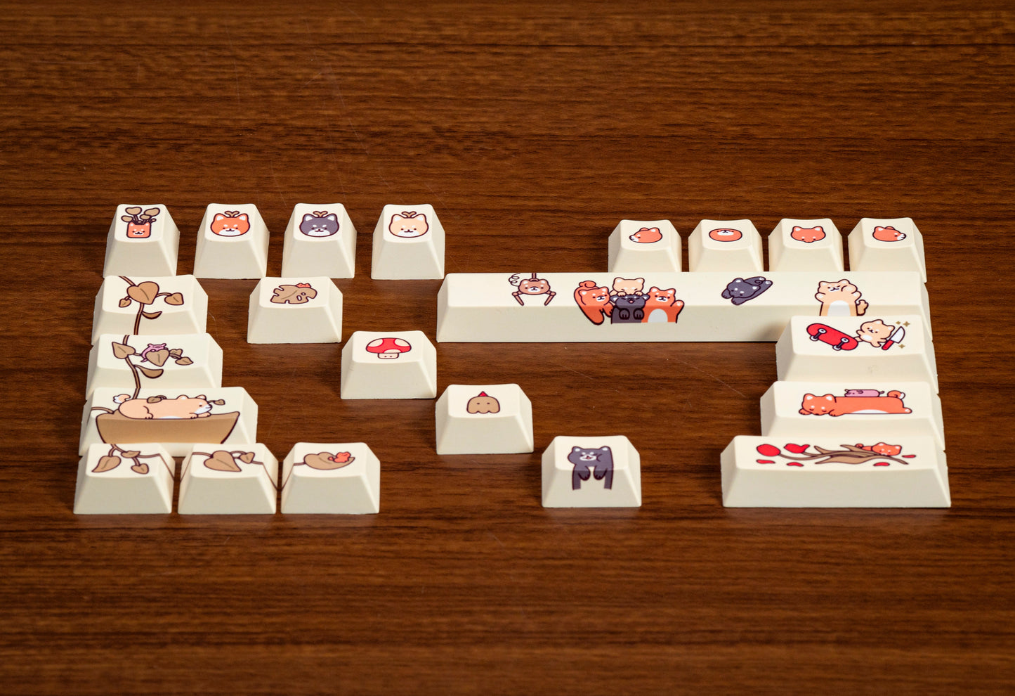 Assorted cream keycaps with animal and food character prints arranged in word-like shape