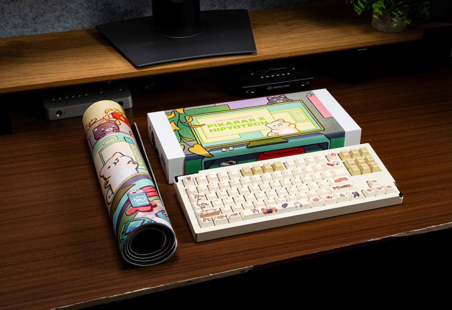 Keycap set in open packaging on wooden desk, cream keycaps with character themed legends