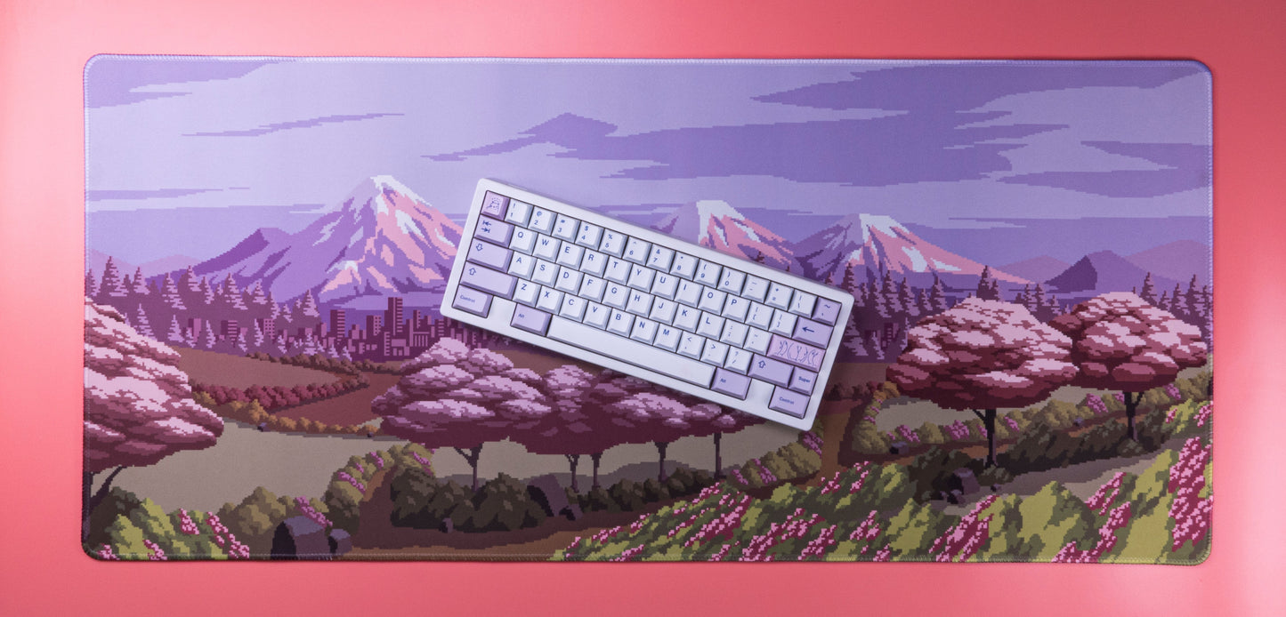 Spring Time desk mat with lavender backing and pixel art spring landscape