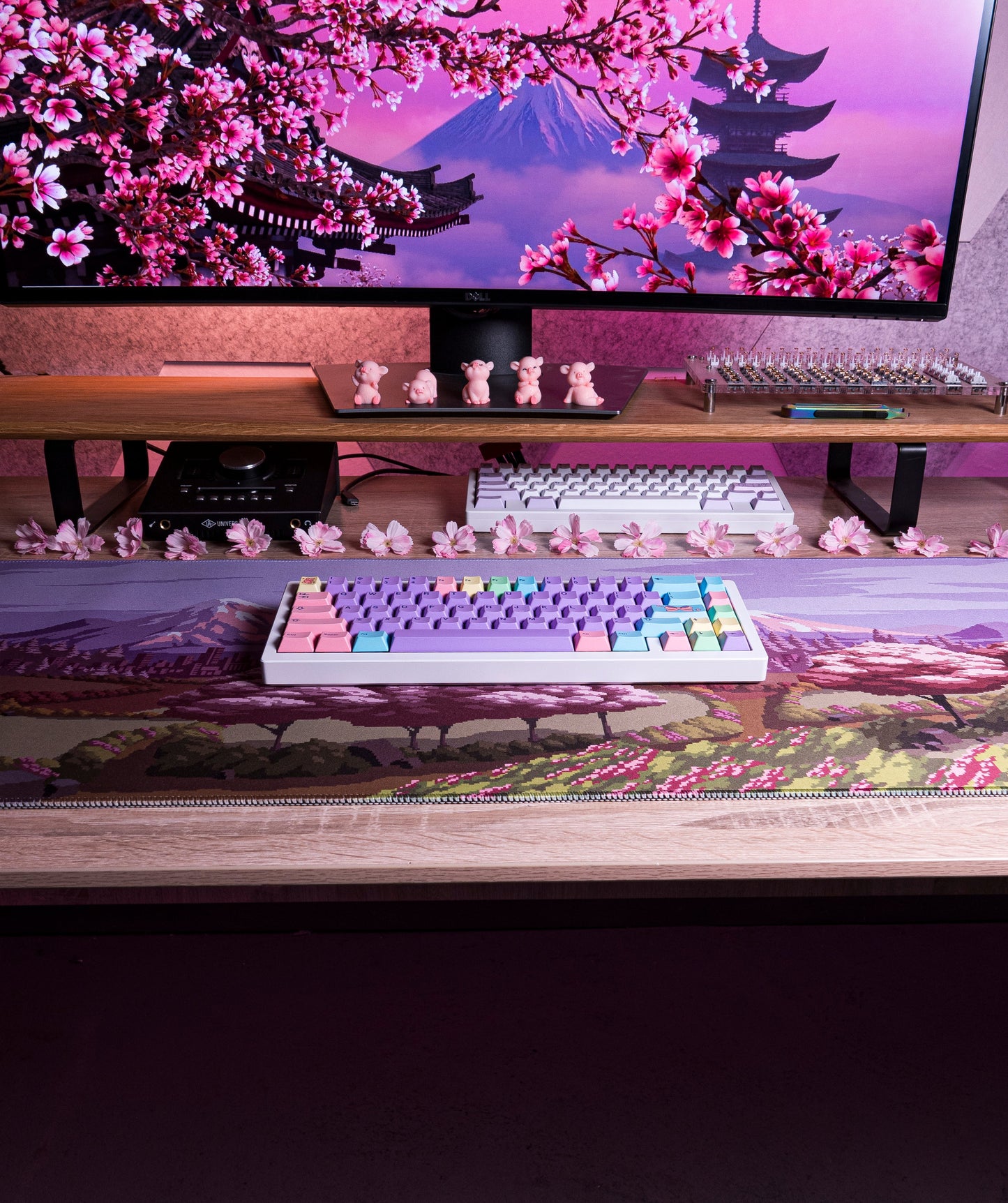 Spring Time desk mat featuring pink cherry blossom and mountain landscape graphic