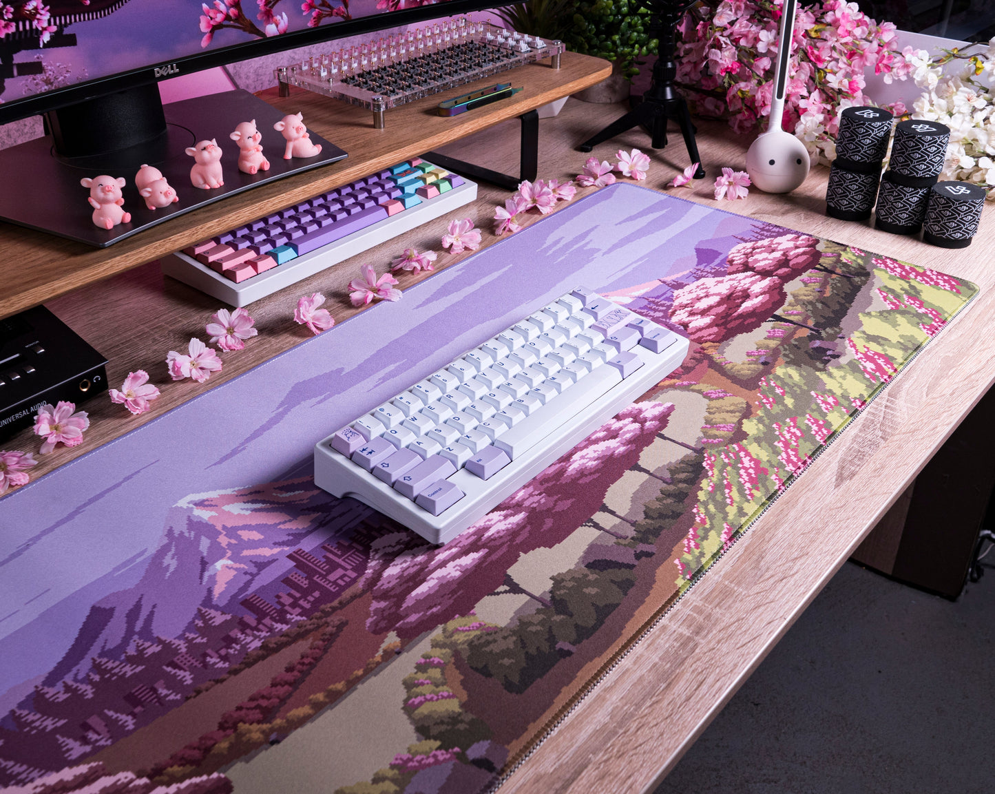 Spring Time desk mat with lavender landscape print, pink blossoms, and forest details