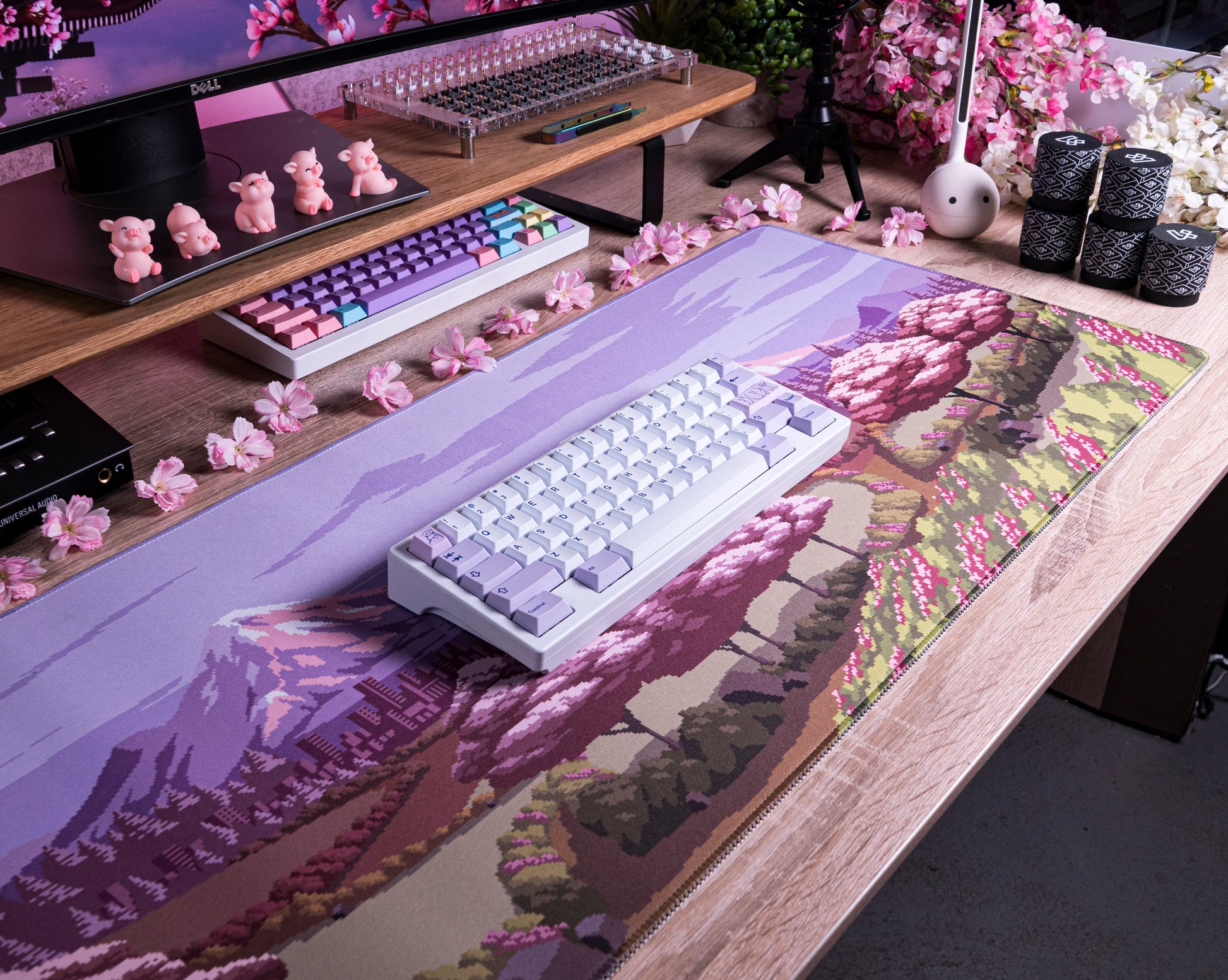 Spring Time desk mat with lavender landscape print, pink blossoms, and forest details