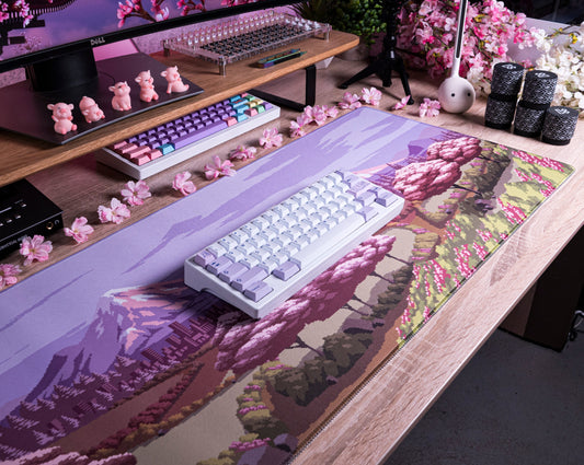 Spring Time desk mat with lavender landscape print, pink blossoms, and forest details