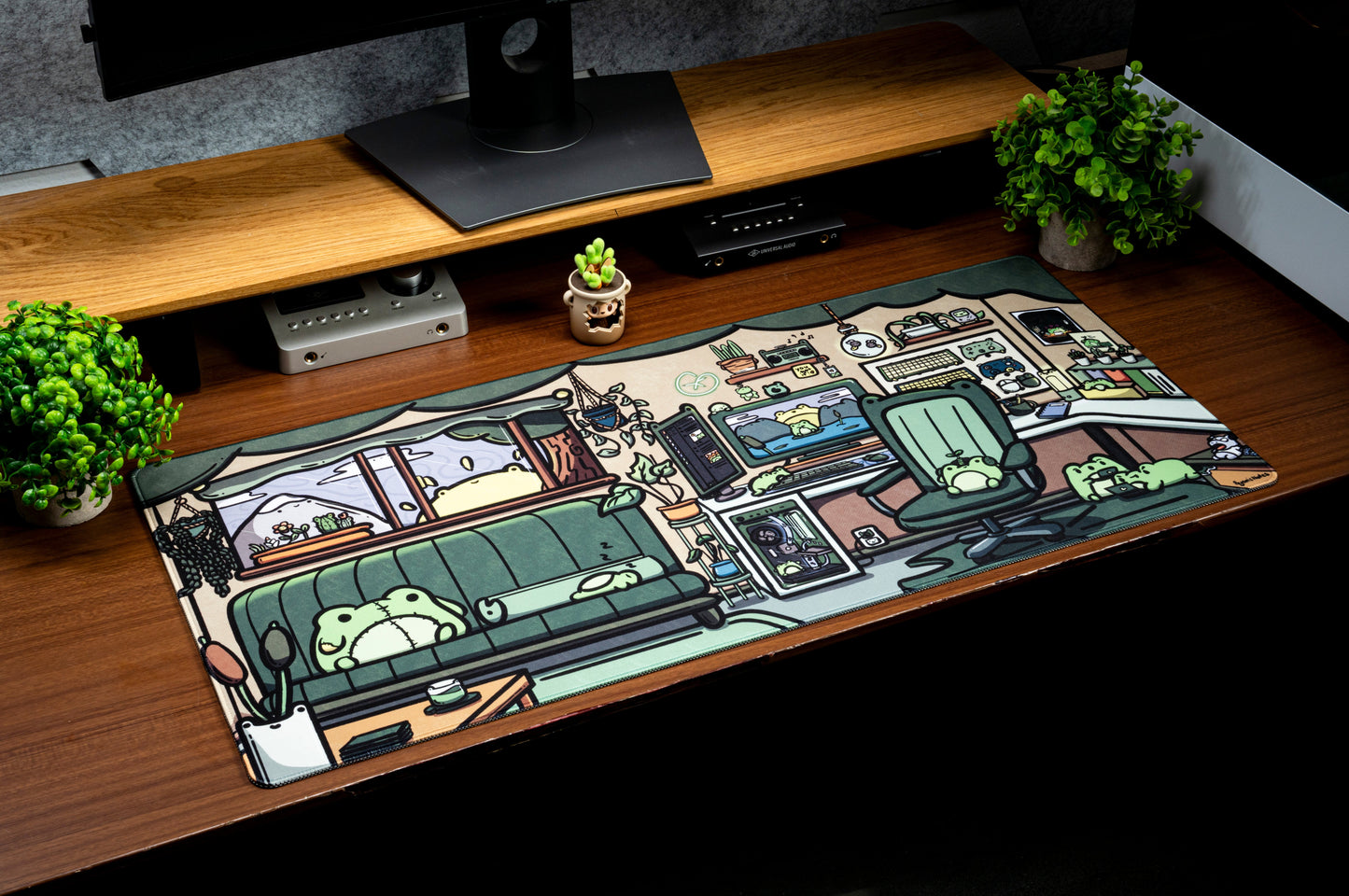 Frog-themed office desk mat with cartoon office scene, laid on a wooden desk