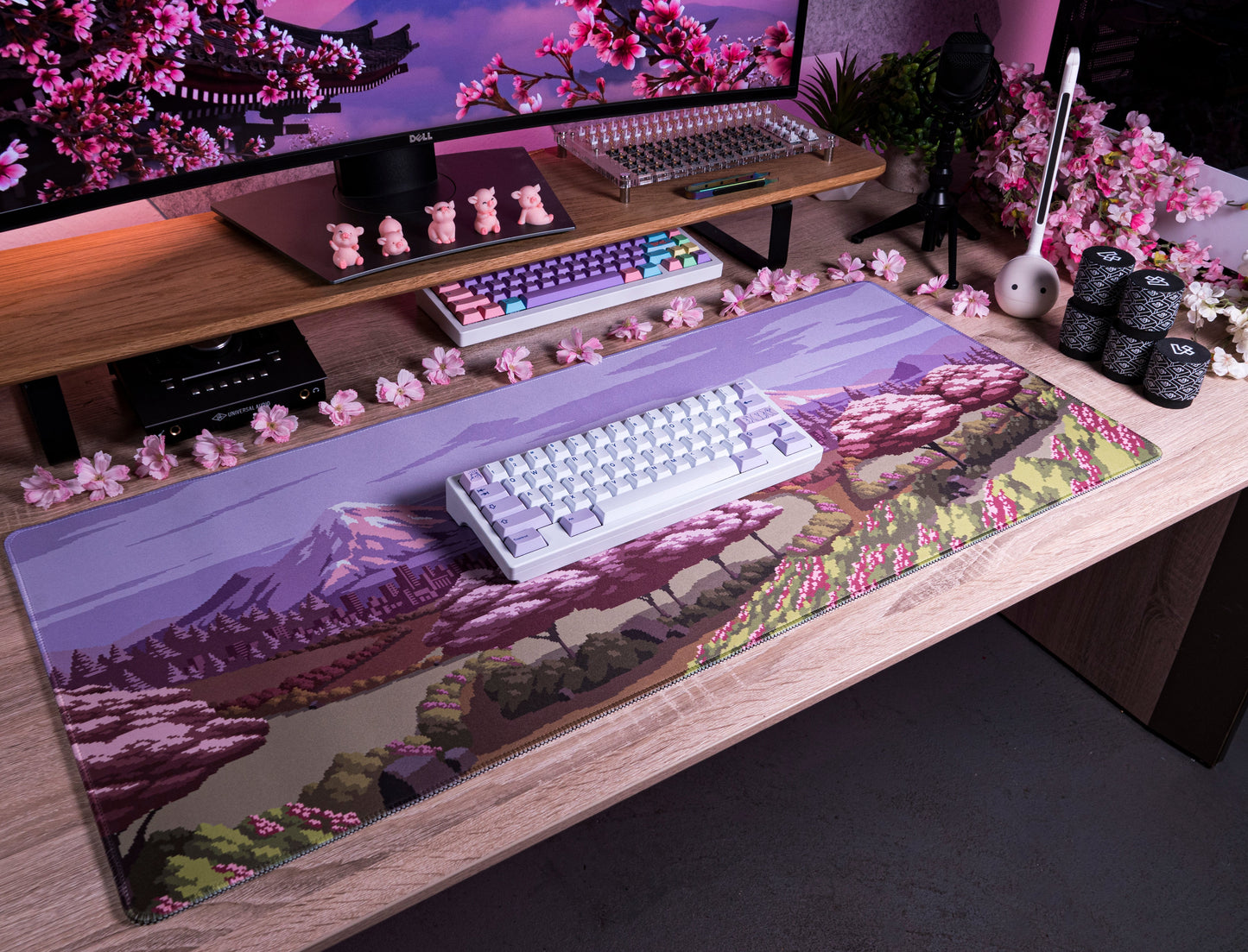 Spring Time desk mat with scenic mountain print, pink blossoms, and garden path