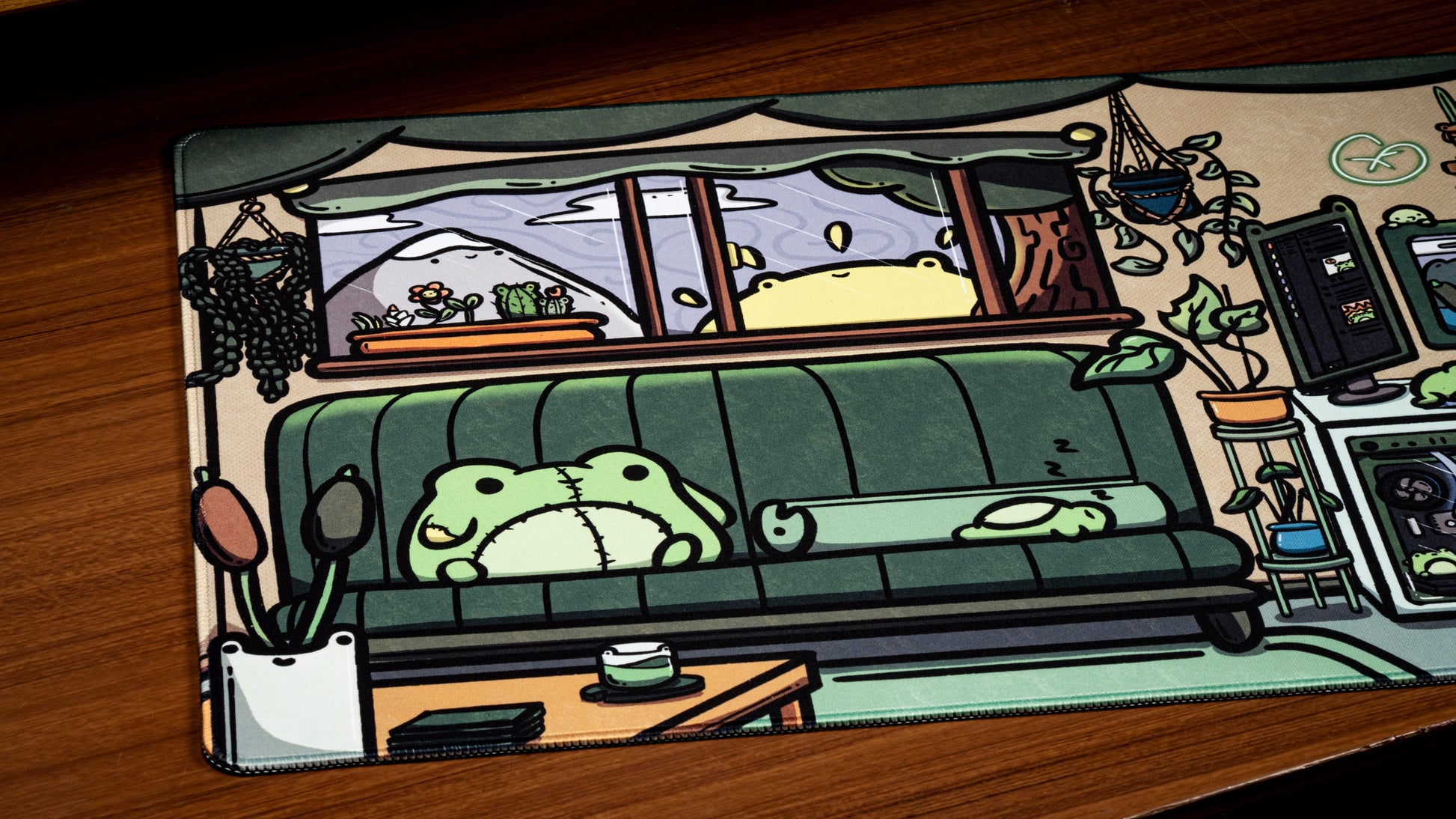 Frog-themed office desk mat with cartoon couch, frog character, and window scene