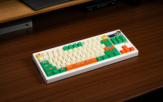 Colorful PBT keycap set on white base, cream, green, and orange cartoon keycaps