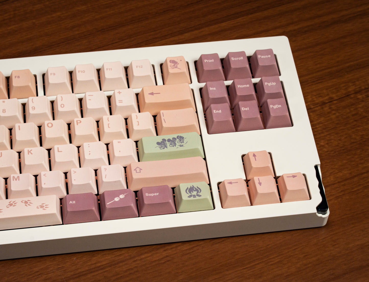 Partially visible field mouse PBT keycaps, pastel cream cluster with purple function keys