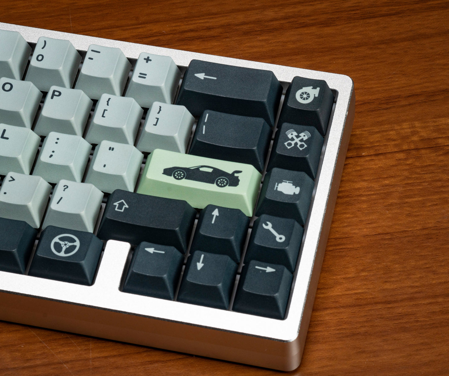 Close-up of keycaps on keyboard: mint-white legends with dark function keys