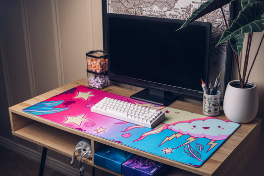 Colorful cartoon desk mat with cloud character, stars, lightning, and flame graphics