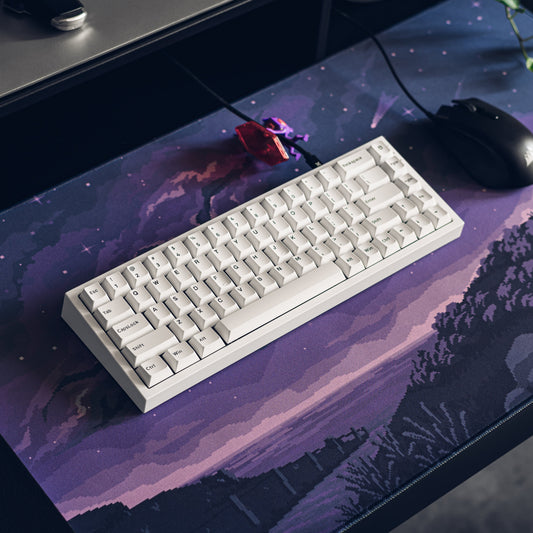 Purple cosmic pixel desk mat with starry sky and mountainous landscape