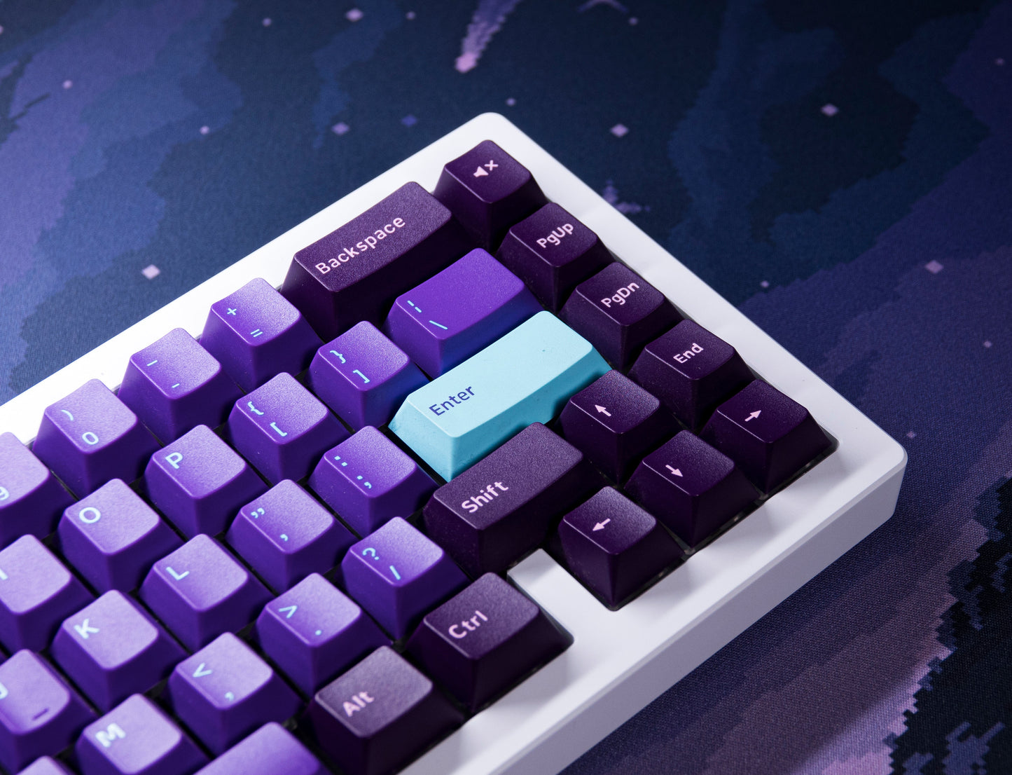 Galaxy PBT keycaps close-up with purple keys and light-blue Enter key on white base
