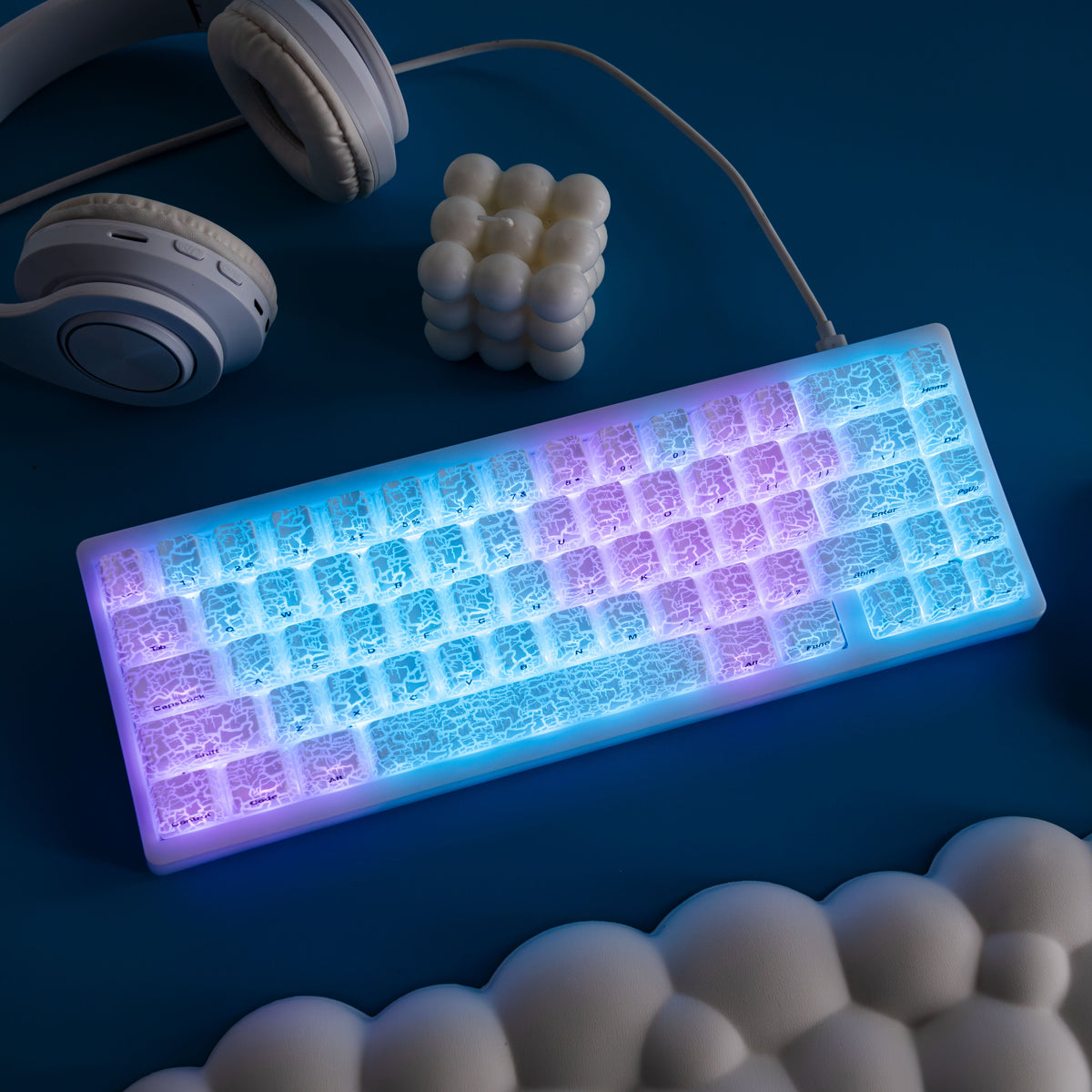 Ice crack pattern shine-through keycaps glowing blue with purple accents